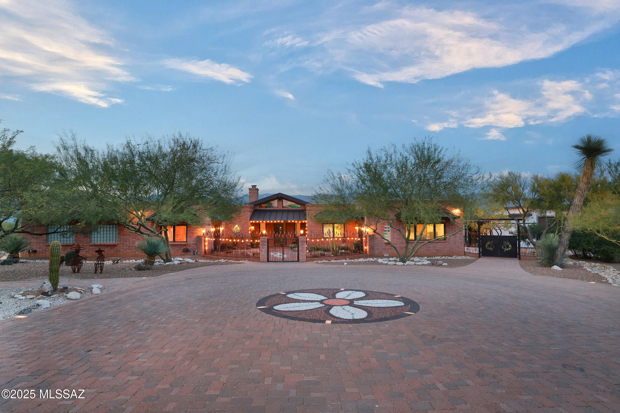 Incredible views of the Catalina & Rincon Mtns on 3.3 acres. Southwest style home showcases quality craftsmanship & decorative finishes. 2 Owners' Suite's each with private sitting room & full baths, plus 2 add'l bedrooms & baths. Kitchen has alder cabinets, custom hardware, double ovens, 2 stovetops & more. Spacious office with private entry.  Oversized 3-car garage with laundry & large storage room. Backyard, an entertainer's dream with a sparkling pool, poolside ramada, outdoor shower, covered patios, pizza oven and garden shed. Beyond the enclosed yard, discover an Artist Studio & Workshop/4th Garage. Near Saguaro National Monument East & Agua Caliente Park, golf, hiking & biking.Tanque Verde Schools. Low HOA.
