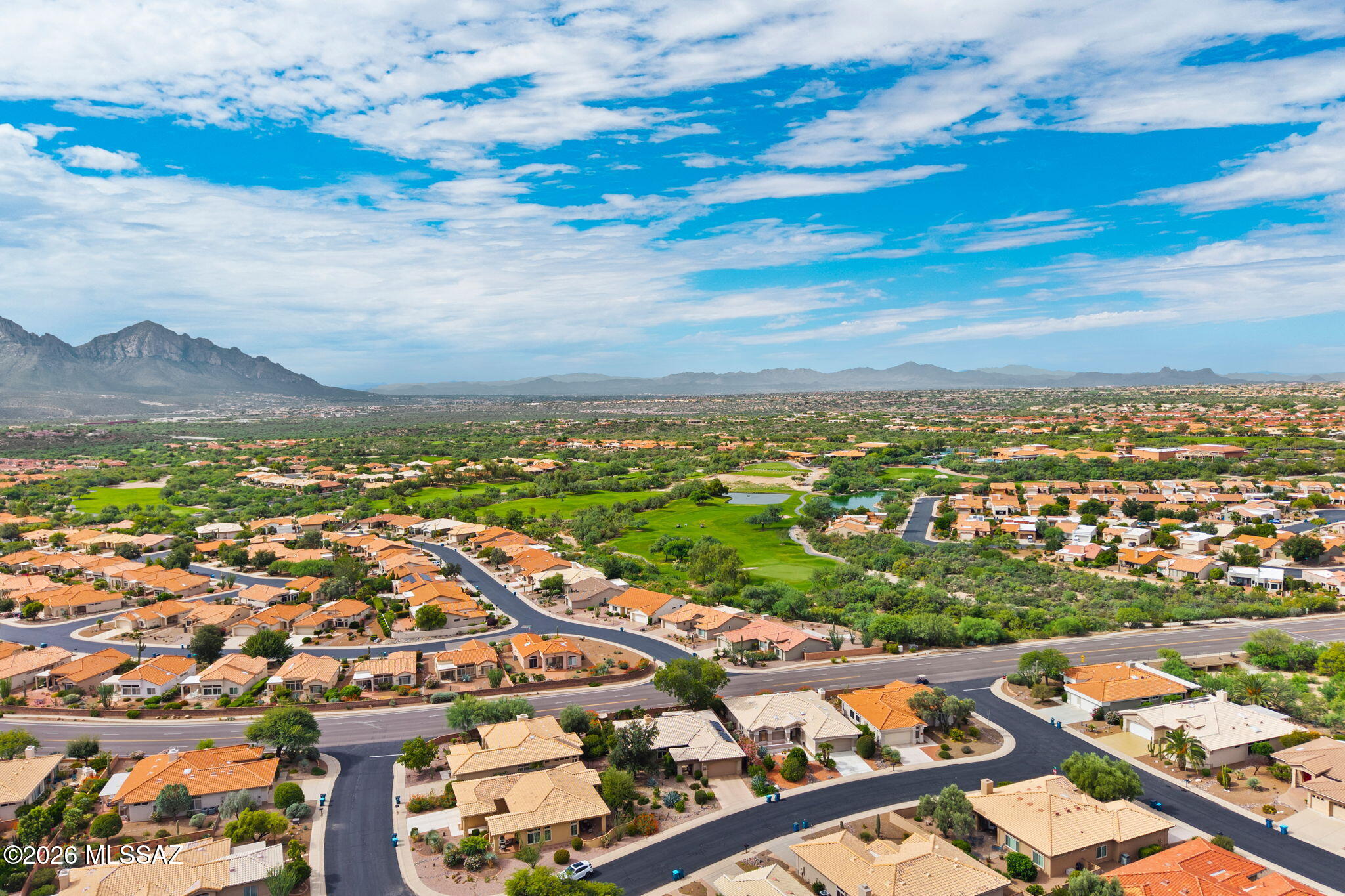 Welcome to your dream home in Sun City Rancho Vistoso! This beautifully remodeled Del Webb Sunrise model sits on a premium lot with breathtaking Santa Catalina Mountain views. Enjoy Arizona living on the spacious flagstone patio and upgraded Arizona room, complete with motorized sun shades. The remodeled kitchen features granite countertops, modern cabinetry, upgraded fixtures, and a stylish bar. The living room showcases a floor-to-ceiling stone fireplace and Bose indoor/outdoor speakers. The luxurious primary suite offers a remodeled bath with walk-in shower, soaking tub, dual vanities, makeup station, and walk-in closet. Additional highlights include plantation shutters, skylights, remodeled guest bath, 2019 roof, and rolling patio shutters. Resort-style amenities include golf, pools, fitness, recreation, and trails!