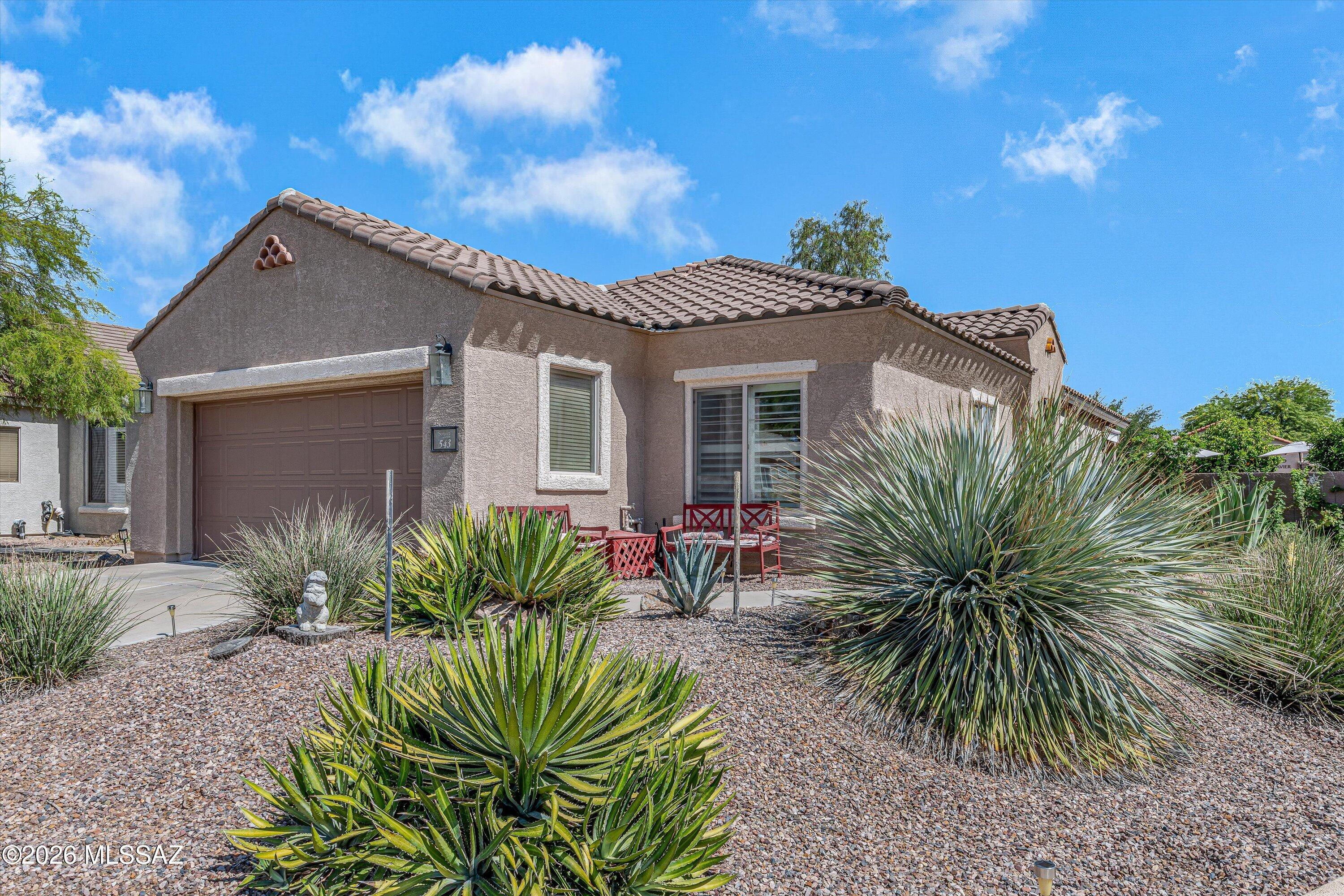 Enjoy all that 55+ living has to offer in this charming turn-key property located in Sonora by Del Webb in Rancho Sahuarita. The home sits on a large corner lot with no neighbors behind and is just steps away from the exclusive 55+ Sonora Clubhouse. Enjoy the backyard oasis, perfect for entertaining with the built-in barbecue and/or lounging in the shade of the fruit trees. The home features a newer HVAC (5 years old, serviced every 6 months), upgraded bathrooms with new bidet toilets, kitchen with island and stainless steel appliances, white shutters throughout and more. With a home in excellent condition like this one, you will have more time to enjoy the exclusive Sonora Clubhouse--meeting neighbors, making friends, playing pickleball, swimming in the heated pool, and so much more