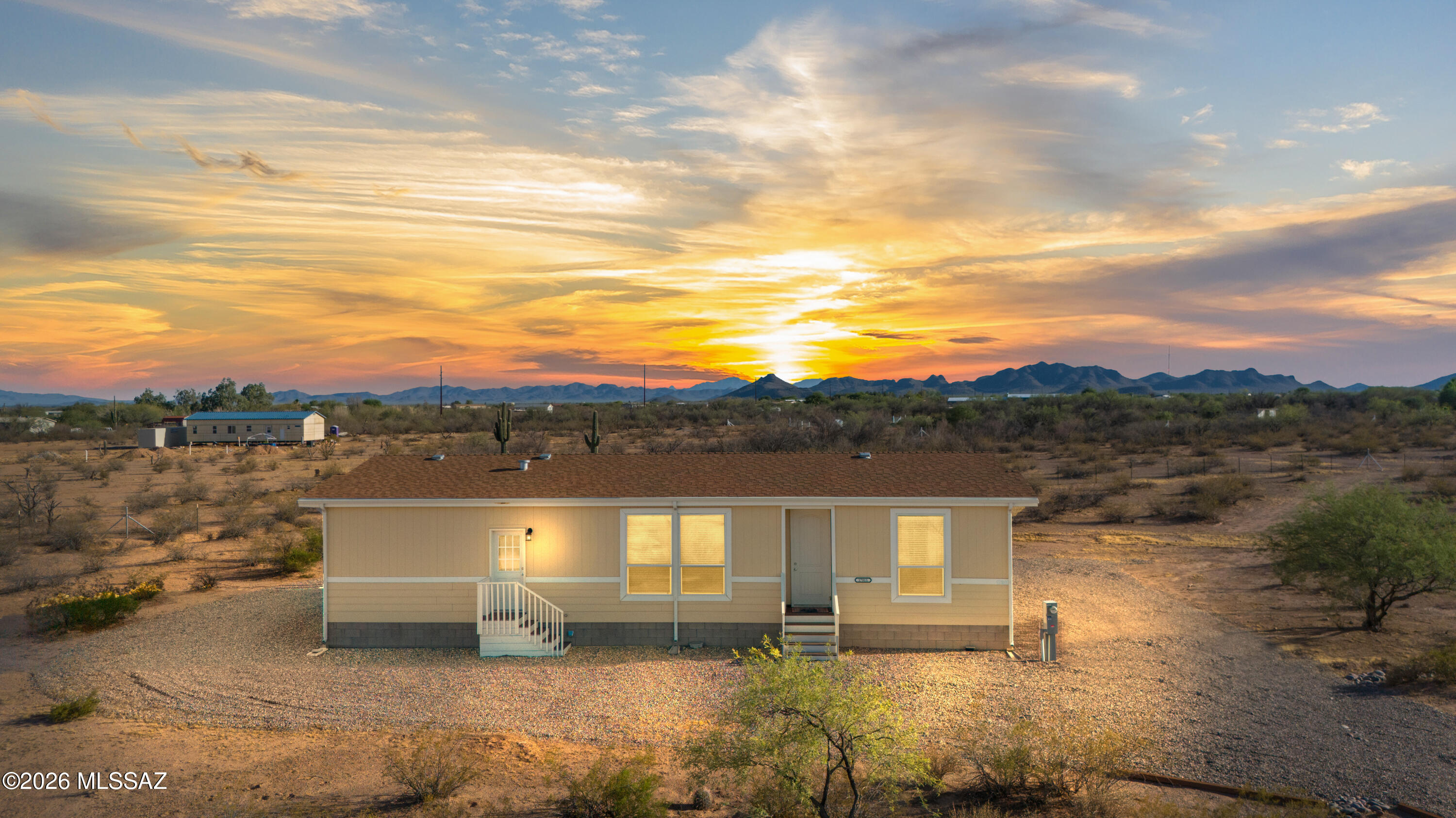 Room to roam! This beautifully maintained 2-year-old manufactured home sits on 4.14 acres in Marana, offering the freedom to live the lifestyle you've been dreaming of. With 3 bedrooms, 2 bathrooms, and 1,680 sq ft, the open floor plan is bright, inviting, and move-in ready. Bring all your toys--RV, trailers, side-by-sides, boats, and more--with plenty of room to park and play. There's also ample space for horses, chickens, goats, gardens, or your dream workshop. Enjoy peaceful desert sunsets, starry skies, and country living with the convenience of nearby shopping, dining, and easy access to town. Endless possibilities await!