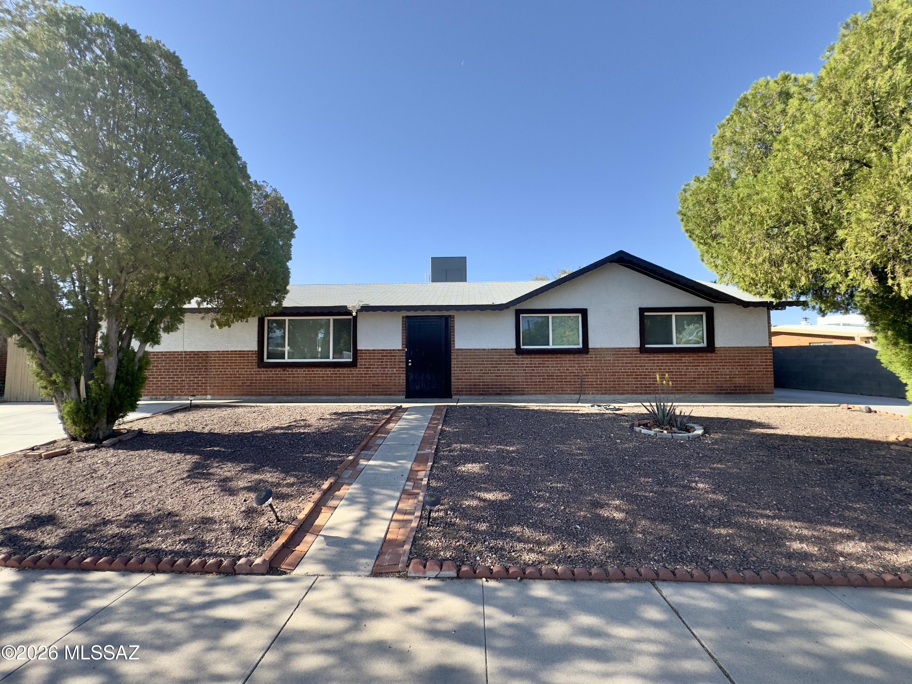 Imagine coming home to a quiet, peaceful street where you can truly unwind. Enjoy new tile flooring throughout the home, complemented by ceiling fans that enhance year-round comfort. The updated kitchen features brand-new cabinetry and a full suite of major appliances, including a dishwasher, gas stove, and microwave, along with a convenient breakfast bar perfect for casual dining. A dedicated laundry area with washer and dryer adds everyday convenience. In addition to 4 spacious bedrooms and 2 bathrooms, the home offers a separate family room and a versatile office or den, ideal for remote work, families, or flexible living arrangements. Weekends are made for relaxing under the covered patio or enjoying the privacy of your large, fenced backyard--perfect for outdoor dining, pets, or simply relaxing. Nestled on a quiet street, this property combines privacy with convenience, offering a peaceful residential setting just minutes from major corridors for an easy commute.