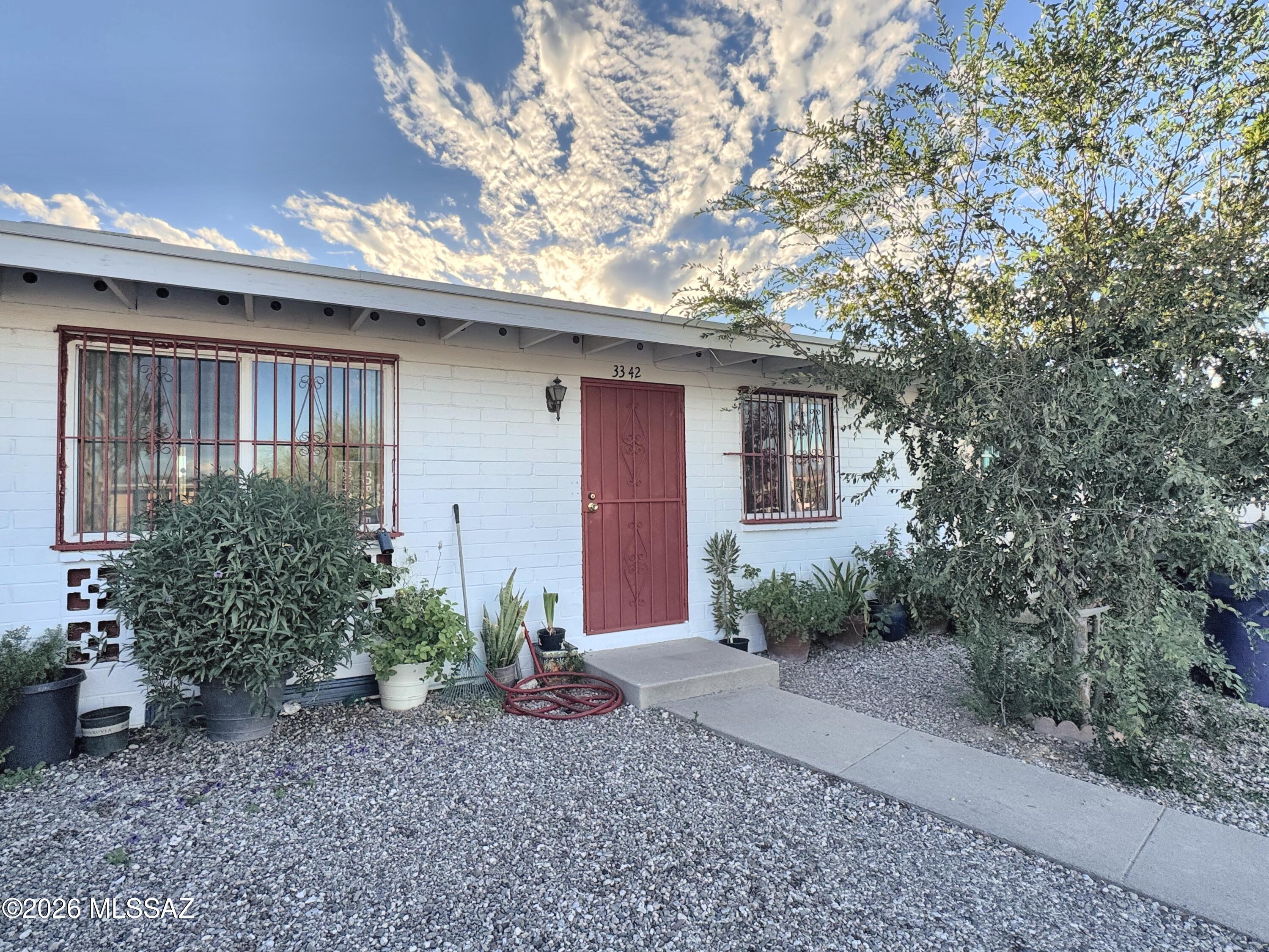 Updated 2 bed, 1 bath townhouse in the Parkside community! This home features new porcelain tile flooring, fresh exterior paint, an extended back patio, and a brand-new block wall and fence in the backyard. 793 sq ft of single-level living with a carport space and a low-maintenance lot. Just minutes from Tucson Marketplace at The Bridges, with so much to offer in dining and shopping. Great option for a primary home or a rental. Come take a look! Possible assumable FHA loan with 3.5% interest rate.