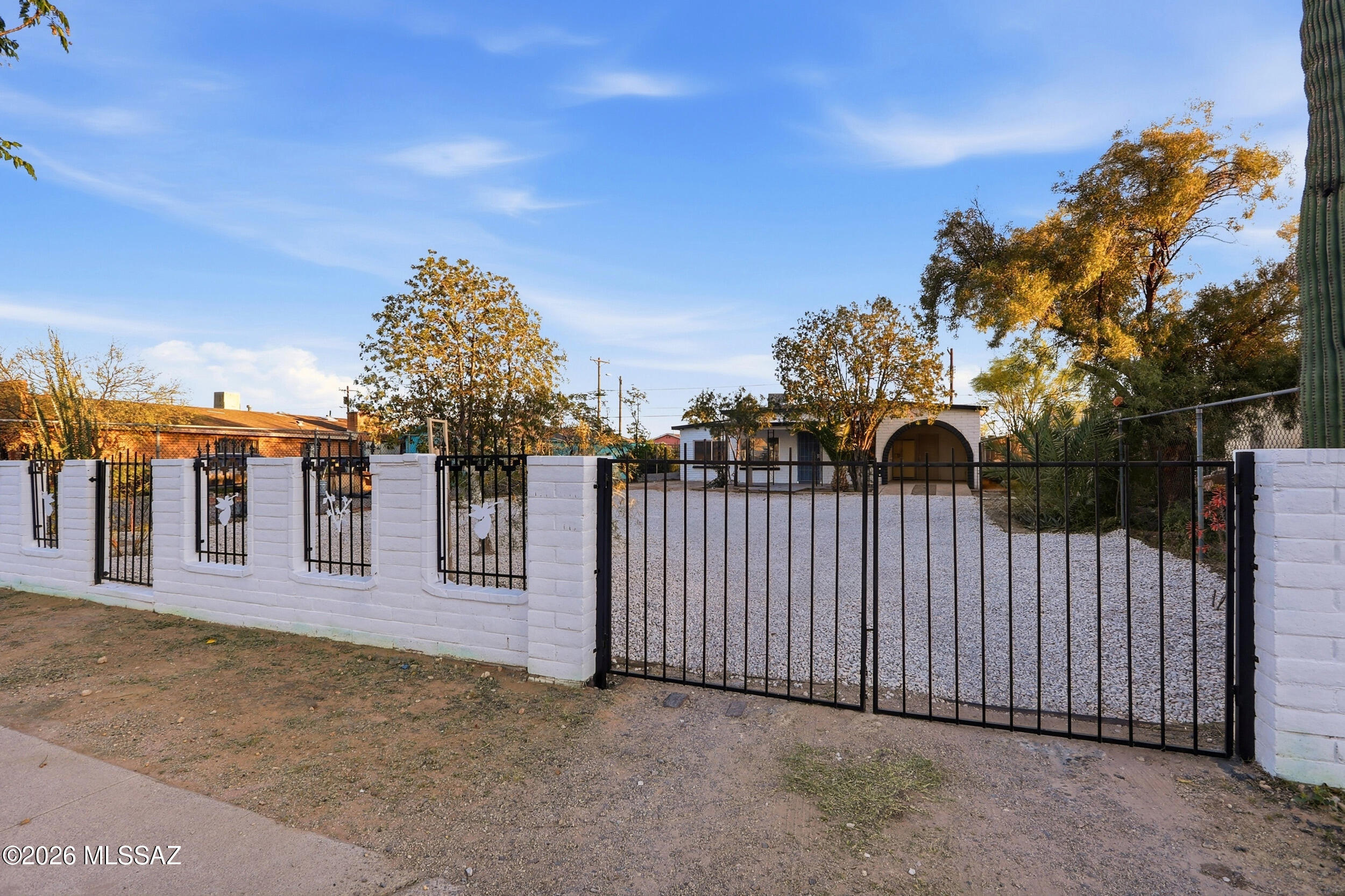 Like-new stunning ranch style home in the Centrally located Homeland neighborhood! This 4 bedroom, 2 bath brick residence has great curve appeal with block/iron fence, convenient 2 car arched carport, large .18 acre lot, and NO HOA! This Casa has been fully remodeled and is truly turn-key. Recent major improvements include new energy efficient windows, updated roof, central HVAC system, new sewer lines/clean-outs, new water lines, new laundry room, new facia, newer water heater and new electrical outlets! Enjoy your mountain views from your large front porch. Upon entering the fully updated interior has been freshly painted and features LED lights, elegant and durable ceramic flooring, ceiling fans, and an open concept. With a large living room that has plenty of space for your sectional and entertainment system. The kitchen features a modern and functional galley way design. With plenty of new white cabinets, SS appliances, gorgeous granite countertops, and marble backsplash for the chef at home. That segues into a large dining area that is perfect for those family meals. From there you have an ample flex room that can be used as an office/4th bedroom. The large primary bedroom has crisp new carpet and includes its own stunning bathroom with a step in shower with tile surround and marble accents to unwind in. While the other three bedrooms offer the flexibility for family needs and to accommodate guests. Relax in your spacious backyard that is perfect for hosting guests and offers room to create your own outdoor Oasis. With pleasant features like privacy chainlink, fully covered porch, outdoor oven, a big workshop and sunset views.. This ideal home is located walking distance from Mirasol Park and only minutes away from the freeway, dinning, and the bridges shopping center. Take advantage of this home TODAY! Owner/Agent.