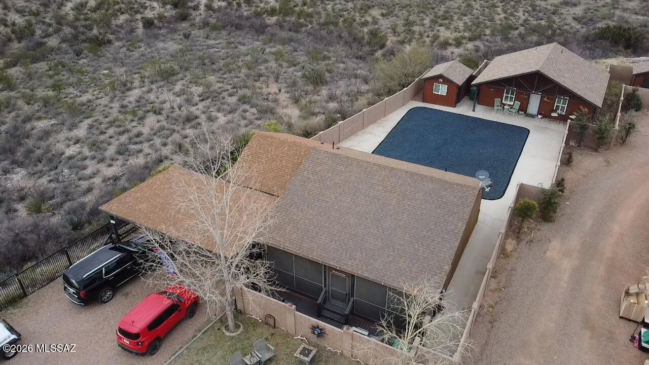 Welcome to a rare opportunity on Historic Allen Street in the legendary ''Town Too Tough to Die.'' This unique property offers space, versatility, and breathtaking high-desert scenery on over ¾ of an acre, providing room to live, work, and unwind in one of the most iconic settings in the Southwest. The 1,124 sq ft main residence features 2 bedrooms and 2 bathrooms, blending comfort with character and plenty of stunning surrounding mountain and hill views. Just steps away, a separate 624 sq ft guest house/ADU (currently running as a vacation rental) Built in 2020, with 1 bedroom and 1 bathroom provides ideal accommodations for guests, extended family, rental income, or a private retreat. Designed with flexibility in mind, the property also includes a separate outdoor office building with electricity and a shed.