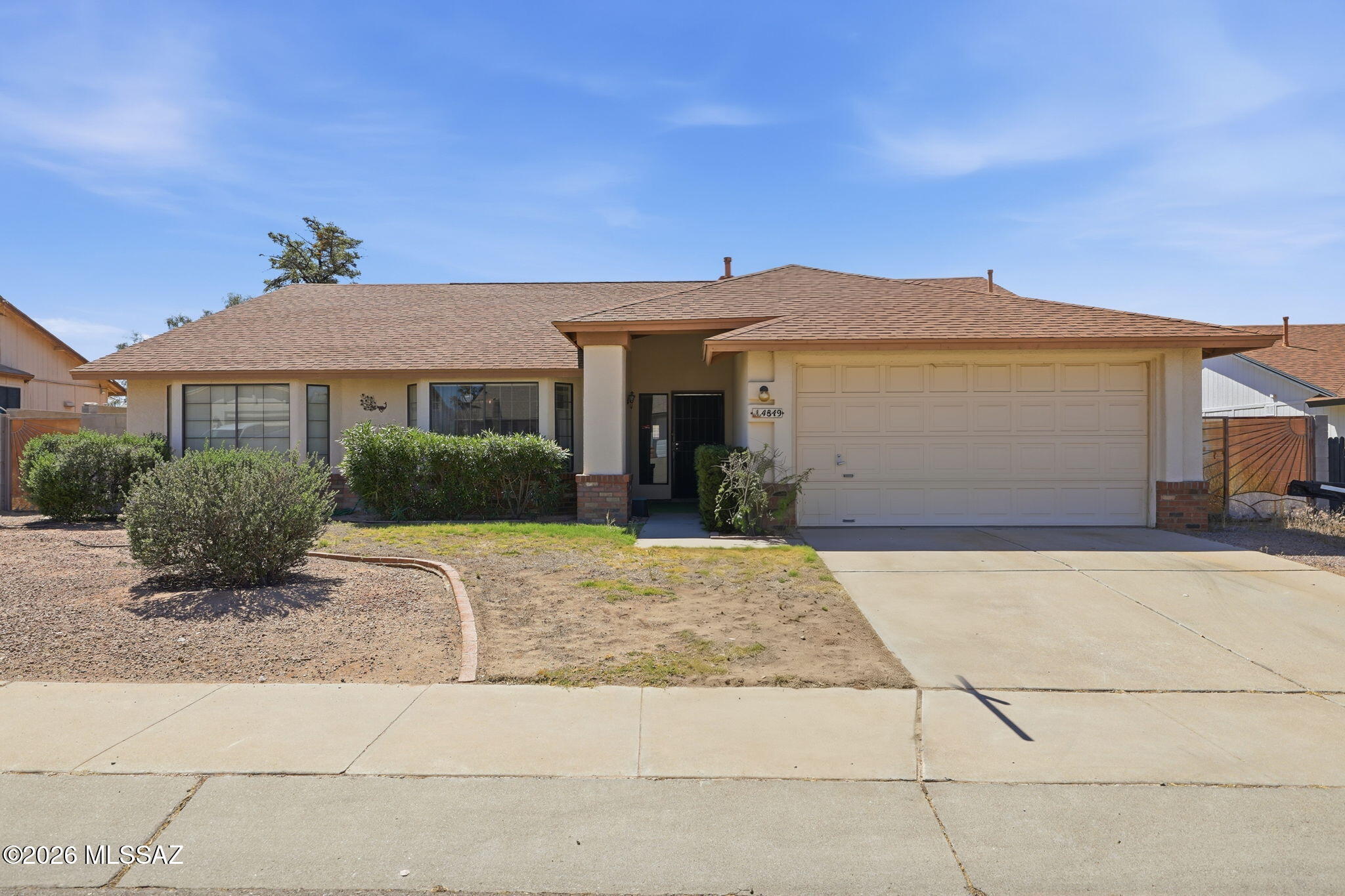Discover your next home in this highly desirable, established Northwest Tucson neighborhood. This charming 3-bedroom, 2-bathroom property boasts a solid floor plan, a spacious 2-car garage, and beautiful, low-maintenance desert landscaping. Outdoor enthusiasts will appreciate being located right near the neighborhood park, complete with walking paths, a playground, and plenty of green space. Offered at a price below the neighborhood average, this home is an incredible find for first-time buyers and investors alike who are looking for a great deal in a fantastic location.