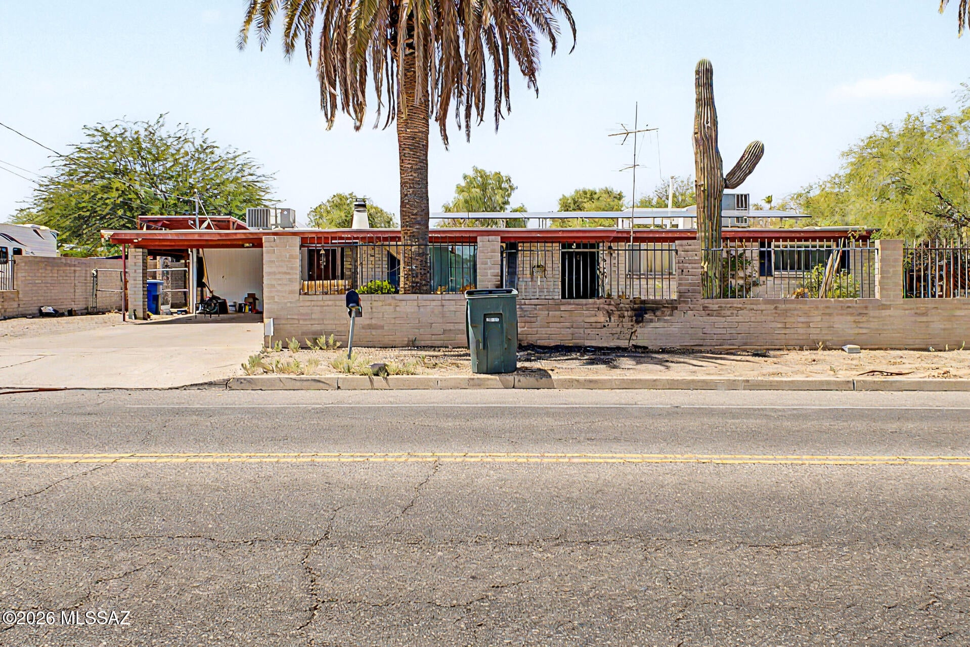 This 3-bedroom, 2-bath home offers plenty of potential for an investor or buyer looking to add value with some TLC. Features include an attached carport, RV gate and separate RV carport, low-maintenance desert landscaping, and mature trees. Inside, the home offers vaulted ceilings, a fireplace, and an eat-in kitchen with skylights, ample cabinetry, and a breakfast bar. The backyard features an extended covered patio, storage sheds, and plenty of space to make your own. With the right updates, this property could be a great opportunity to build equity and create something special.