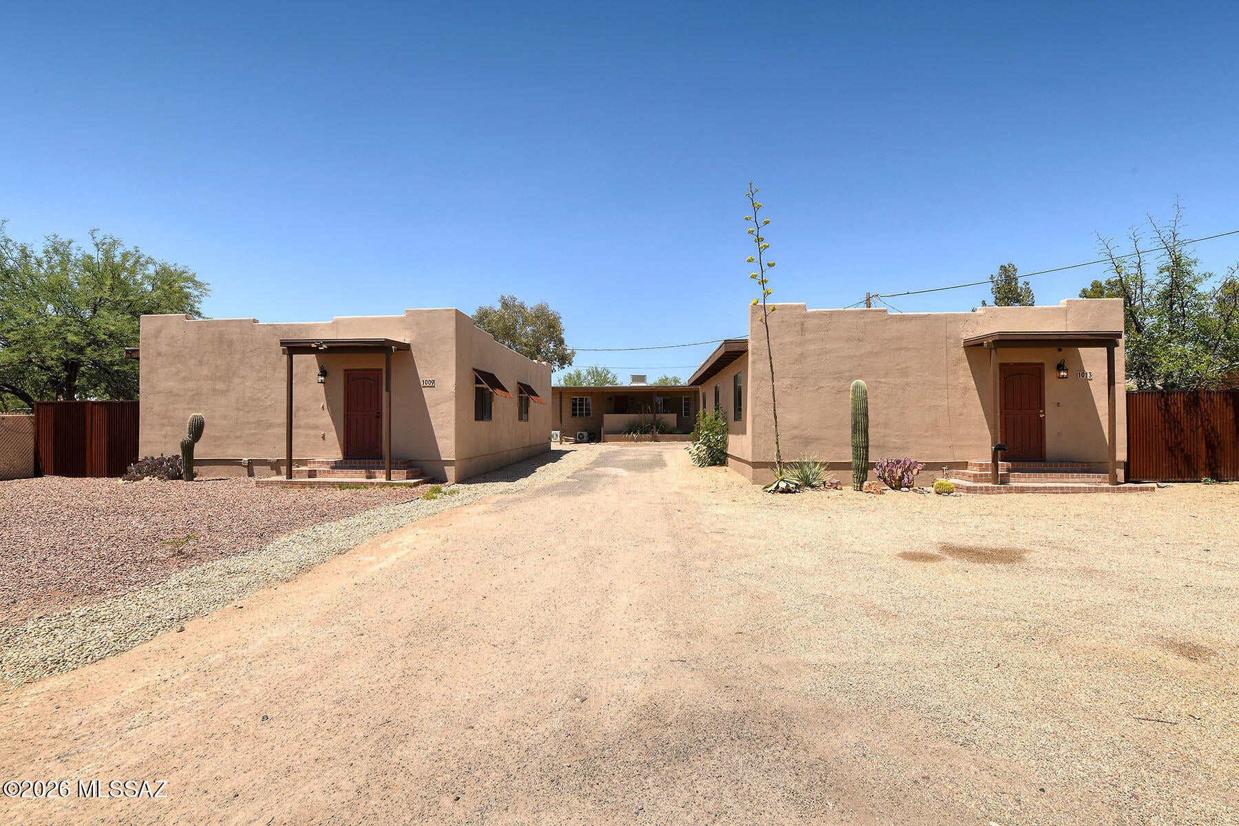 Three Detached SFRs-4 total Units! 1009, 1011 A/B and 1013 East Halcyon Road! Investor-ready multifamily in central Tucson sited
on over 18,000 SF of R-2 zoned land, comprised of three separate tax parcels--offering flexible financing and long-term strategic flexibility. The 4,412 SF property spans three buildings with a desirable unit mix. 1009 & 1013 were built in 2005 feature 3-bed/2-bath units with scored concrete and ceramic tile floors. 1011 is a charming 1952 built 3 Bed 2 1/2 ba 1752sf home with a lower level 1bed/1 Bath guest quarters (500sf). Both upper and lower share a laundry room. 1009 and 1013 have their own laundry rooms.