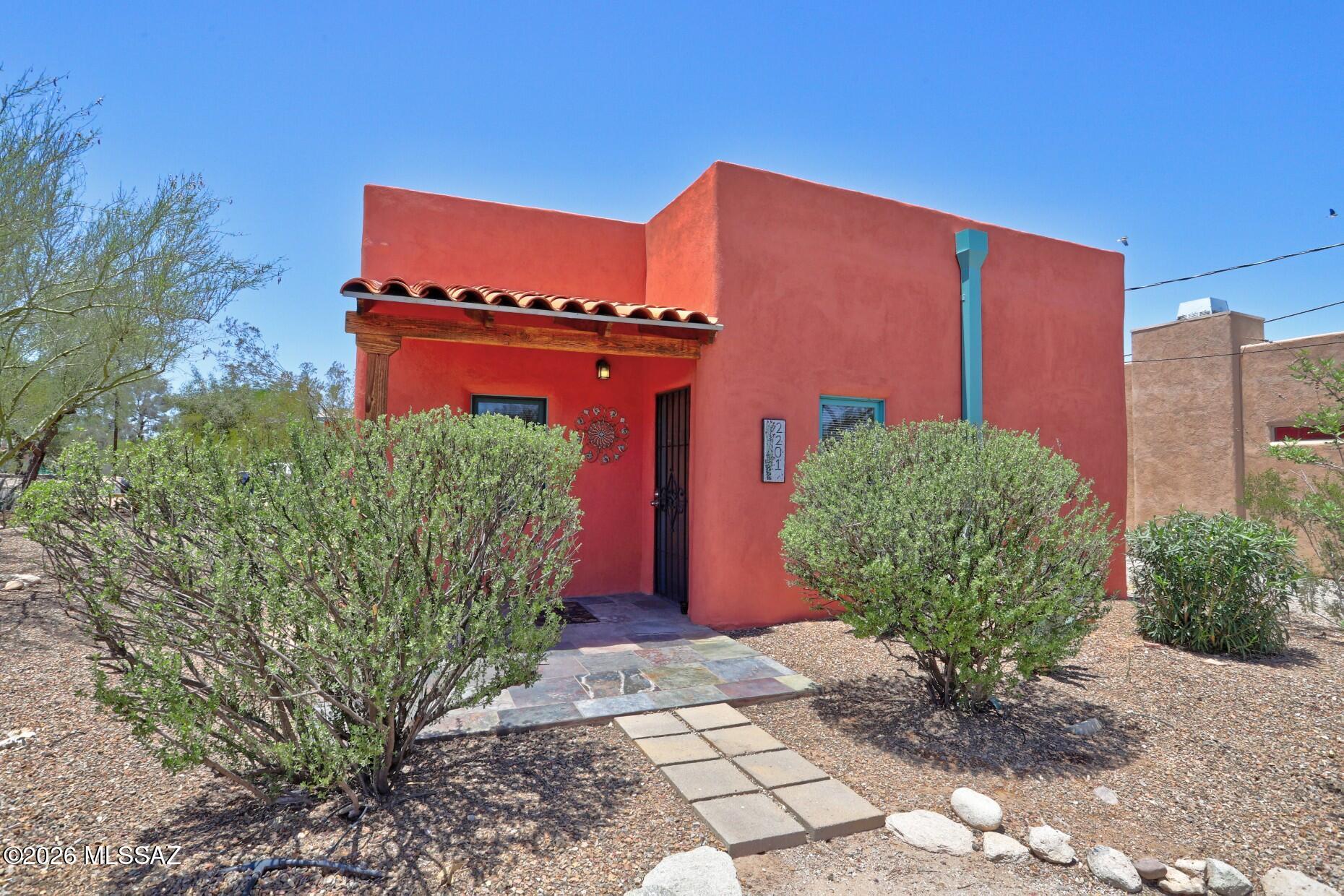 Two homes sit on a large corner lot in sought-after Blenman-Elm: one is a piece of Tucson history, and the other is a beautiful new ADU. The main house offers two bedrooms, two bathrooms, a large kitchen with new appliances, and comfortable living spaces, blending thoughtful updates with old-world charm. The brand-new two-bedroom, two-bath ADU includes hickory cabinets and new appliances in the kitchen, French doors in the primary bedroom and an EV charger at the front of the house. The two homes can be connected by a gate in the shared fence or kept separate.
In 1934, the main house was home to the parents of famed Arizona artist Ted DeGrazia, Salvatore and Lucia DeGrazia as well as his siblings. The property was a lively compound for music and family. Today, only the main house remains preserving the site's rich history while offering updated living spaces.
Natural desert landscaping and flowering shrubs attract quail families and many bird species.