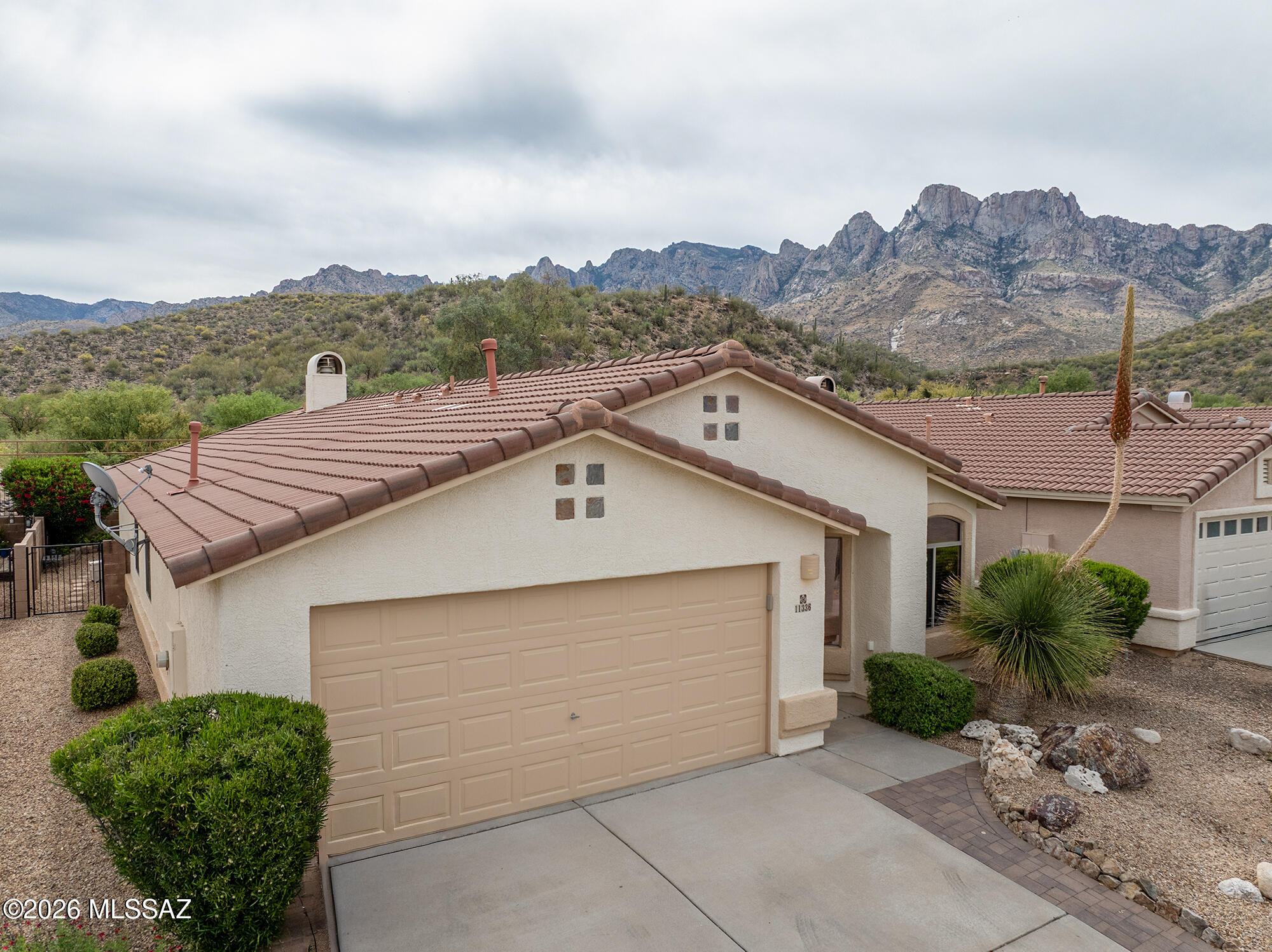 EXPANSIVE AND BEAUTIFUL PANORAMIC VIEW TO THE CATALINAS, the home is located in the back of the quiet sought after neighborhood of Rams Canyon. Located within walking distance of Catalina State Park, the home is very very well maintained with a fireplace in the den and new walk-in master shower. Set in nature with open space in the rear it is also within minutes of shopping, restaurants, the trail system and the Basis Charter School. The layout has both a living room/dining area great room as well as a great room feel with the kitchen, den and breakfast areas. This home is special and a great find.