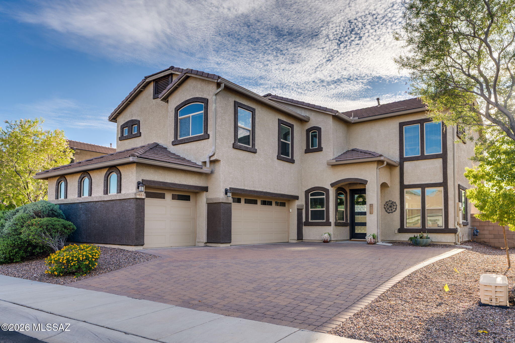 Welcome to this beautifully maintained home in the desirable master-planned community of Saguaro Bloom! Ideally situated near community parks, recreation center, fitness center, pool, and splash pad, this home offers an exceptional blend of comfort, convenience, and Arizona lifestyle. With easy access to I-10 and the Loop. Fresh exterior paint and a stunning new front door create an inviting first impression. The inviting great room features dramatic floor-to-ceiling windows that fill the space with natural light. A formal living area, den, and powder bath add flexibility and functionality to the main level. The kitchen is designed for both everyday living and entertaining, featuring newer gas appliances, a smart refrigerator, single-basin apron-front undermount sink, granite countertops, and a convenient breakfast nook. A separate formal dining area provides additional space for gatherings. Upstairs features a generous primary suite with dual sinks, separate soaking tub and shower, and a walk-in closet. Three additional secondary bedrooms, a full bath, loft, and private balcony provide plenty of space for family, guests, work, or entertaining. Step outside to the low-maintenance backyard, complete with a large artificial turf area and shrubs--perfect for relaxing or enjoying Arizona's beautiful weather with minimal upkeep. With no rear neighbor and a peaceful community path and common area behind the home, you'll enjoy an added sense of privacy and expansive views. Located in the vibrant Saguaro Bloom community with resort-style amenities and convenient access to major roadways, this home offers the space, upgrades, views, and lifestyle you've been looking for!