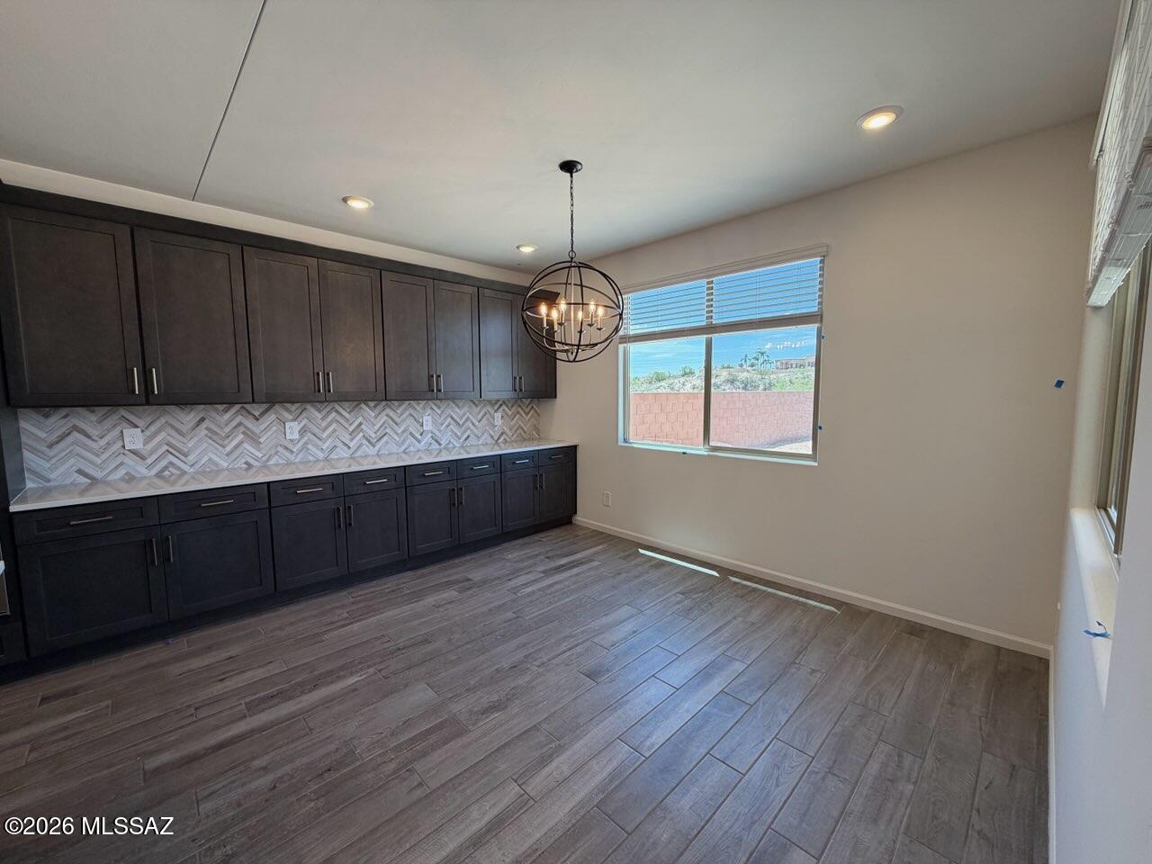 Enjoy the convenience of a 3-car tandem garage and a covered patio--perfect for outdoor living. With 5 bedrooms, this home offers ample space for everyone, including a versatile Teen Room ideal for a home office or study space. Located in the sought-after Naranja Trails community in Oro Valley, this gated neighborhood features gourmet kitchens, spa-inspired primary-suite showers, scenic walking trails, and is just steps from beautiful Naranja Park. Built with innovative, energy-efficient features, this home provides lasting comfort, savings, and peace of mind.