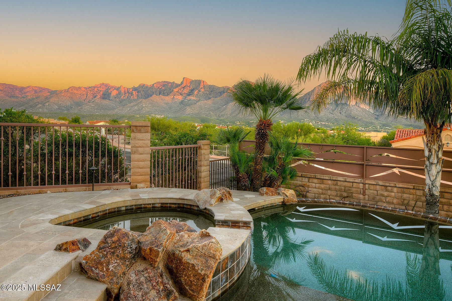 One of the Best Luxury Homes you'll see in Oro Valley this year.  Unobstructed Pusch Ridge Views, Private & Serene. You'll love the New, Naranja Dr. Multi-use Path for Walking, Jogging & Biking.  Refined SW Contemporary Design tied together in a Light-filled Floor Plan.  No Interior Steps! Lofty Ceilings, Expansive Windows, Slate Floors & New Luxury Vinyl in Guest Bedrooms.  Gorgeous Kitchen with Custom Mesquite Cabinetry and Quality Granite Counters.  Seamless indoor-outdoor flow from Great Room to Covered Patio.  Solar Heated Pool & Spa, Outdoor Bar & Grill, and Easy-care, Professionally Landscaped Yard.  Deep Setback, Spacious Driveway and Gated Courtyard.  Formal Entry and Secluded Master Suite w/Garden Tub & Walk-in Shower. Meticulously Maintained. See List of Seller Improvements.