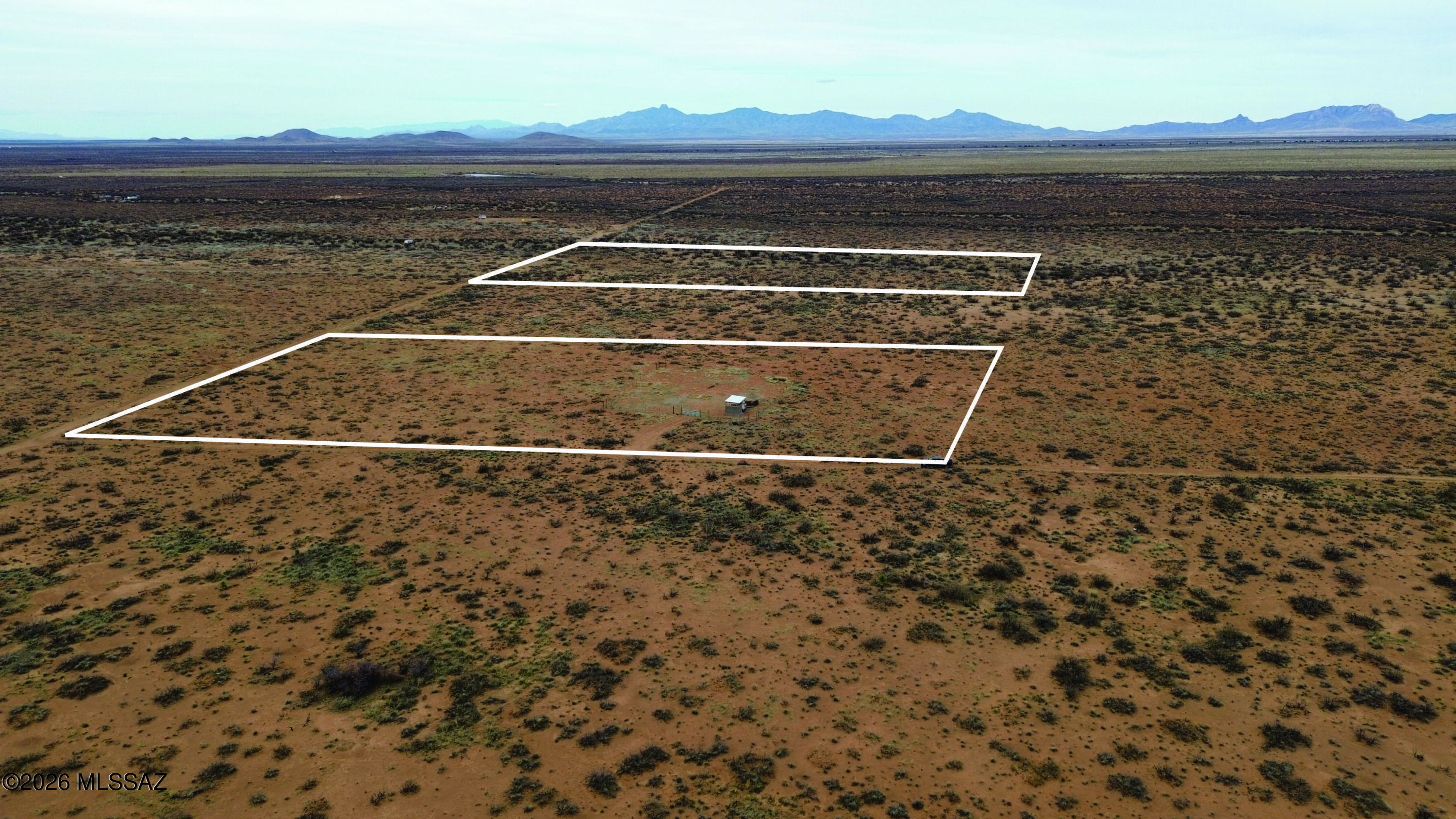 Here is your chance to own two 5 acre Cochise County RU-4 parcels. Set with a picture-perfect view of the Chiricahua Mountains. Short drive to Historic Tombstone, Bisbee and other Cochise County sites. Infamous Tombstone villain Johnny Ringo's grave is just a few miles away. Here is your chance to start your off grid dream. There are two parcels included with the sale parcels 401-53-008 and 401-53-024. Parcels are separated by one parcel which may also be able to be acquired. Travel trailer on the property will also convey in the sale.