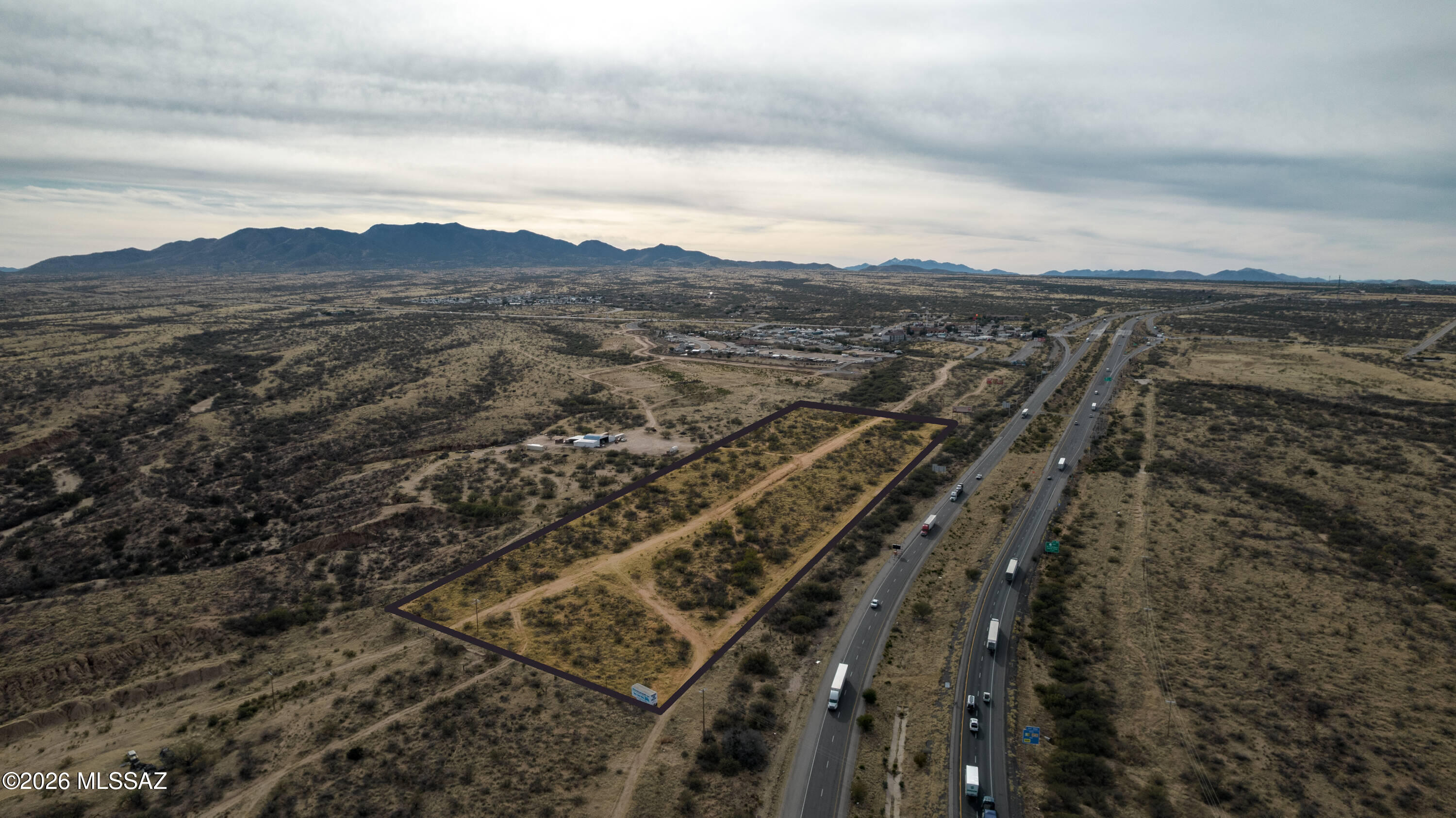 Two contiguous commercial parcels totaling 31.83 acres at the I-10/State Route 90 interchange in Benson, AZ. Includes 17.32 acres (APN 123-11-005) and 14.51 acres (APN 123-11-006A), available together or separately. Located at Exit 302, the primary I-10 connection to Sierra Vista/Fort Huachuca, with approx. 31,847 vehicles/day and 23% truck traffic. B-2 General Business zoning allows hotels, service stations, truck/fleet services, retail, auto sales and more. Level vacant land with 2025 ALTA and topo surveys available. Opportunity Zone through 12/31/28. Offered together at $1,295,000 ($40,684/acre). Buyer to verify all information. Two contiguous commercial land parcels totaling 31.83 acres strategically positioned at the Interstate 10 and State Route 90 interchange in Benson, Arizona. The property consists of a 17.32-acre parcel (APN 123-11-005) and a 14.51-acre parcel (APN 123-11-006A), available together or individually.

Located at I-10 Exit 302--the primary connection between Interstate 10 and the Sierra Vista/Fort Huachuca corridor--the property benefits from approximately 31,847 vehicles per day, including an estimated 23% truck traffic. An established interstate travel center and dedicated diesel truck-parking facility are located within the immediate interchange area, reinforcing demand for highway-oriented commercial services.

The property is zoned B-2 General Business, allowing a broad range of uses, including hotels and motels, service stations, truck and fleet maintenance, freight forwarding, automobile sales and services, retail, and other commercial operations. Warehousing, distribution, light manufacturing, RV parks, and additional industrial uses may be available through conditional-use approval.

The land is vacant and generally level with a slight easterly fall. A 2025 ALTA survey and topographic survey are available. The property is also located within a federally designated Opportunity Zone through December 31, 2028.

Offered at $1,295,000 for both parcels, approximately $40,684 per acre. Contact the listing agents for individual-parcel pricing and additional due-diligence materials.

All information is from sources deemed reliable but is not guaranteed. Buyer shall independently verify zoning, access, utilities, acreage, development requirements, and the suitability of the property for any intended use.