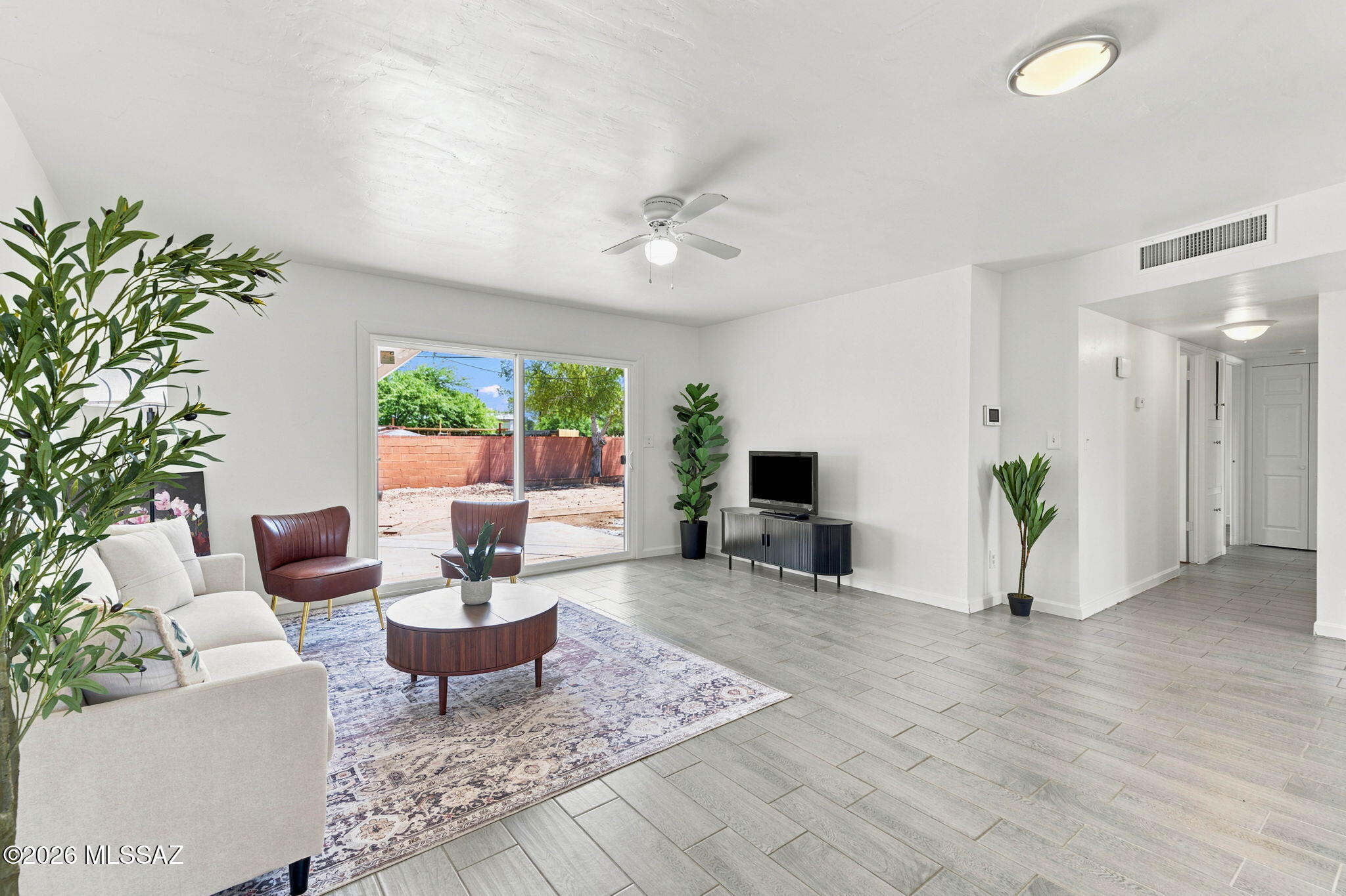 Beautifully updated 3-bed, 2-bath ranch style home in Sherwood Village Terrace. Prime location just minutes from Jesse Owens Park. This home features newer flooring, newer AC, stove and fresh interior paint. The open layout offers spacious living areas, a large laundry room and a versatile bonus room for in home office or gym. Mountain and residential views, covered patio, low-maintenance landscaping, RV parking space and convenient east-side location near 22nd & Camino Seco make this move-in ready home a must-see. Large backyard for entertaining! Call today to schedule your tour!