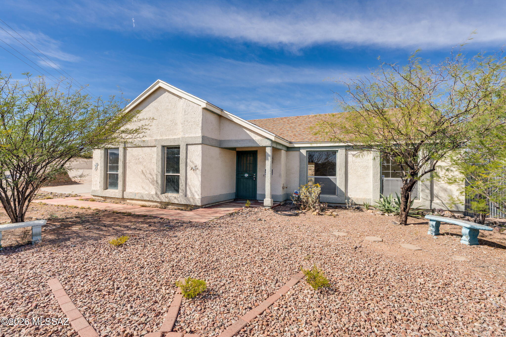 Situated on an expansive .54-acre lot, this 3-bedroom, 2-bath home in Saddlewood Ranch offers space, privacy, and endless potential. A brand new roof (2026) provides peace of mind from day one. With no HOA, you have the freedom to create your ideal setup--add a pool, workshop, RV parking, or outdoor entertaining areas. Inside, enjoy a desirable split bedroom floorplan with vaulted ceilings in the great room, creating an open and airy feel. Ceramic tile and laminate flooring run throughout--no carpet. Step outside to take in the natural desert landscape and mountain views, delivering beautiful scenery and Arizona sunsets. Whether you're looking to expand, invest, or simply enjoy extra space, this property is full of opportunity.