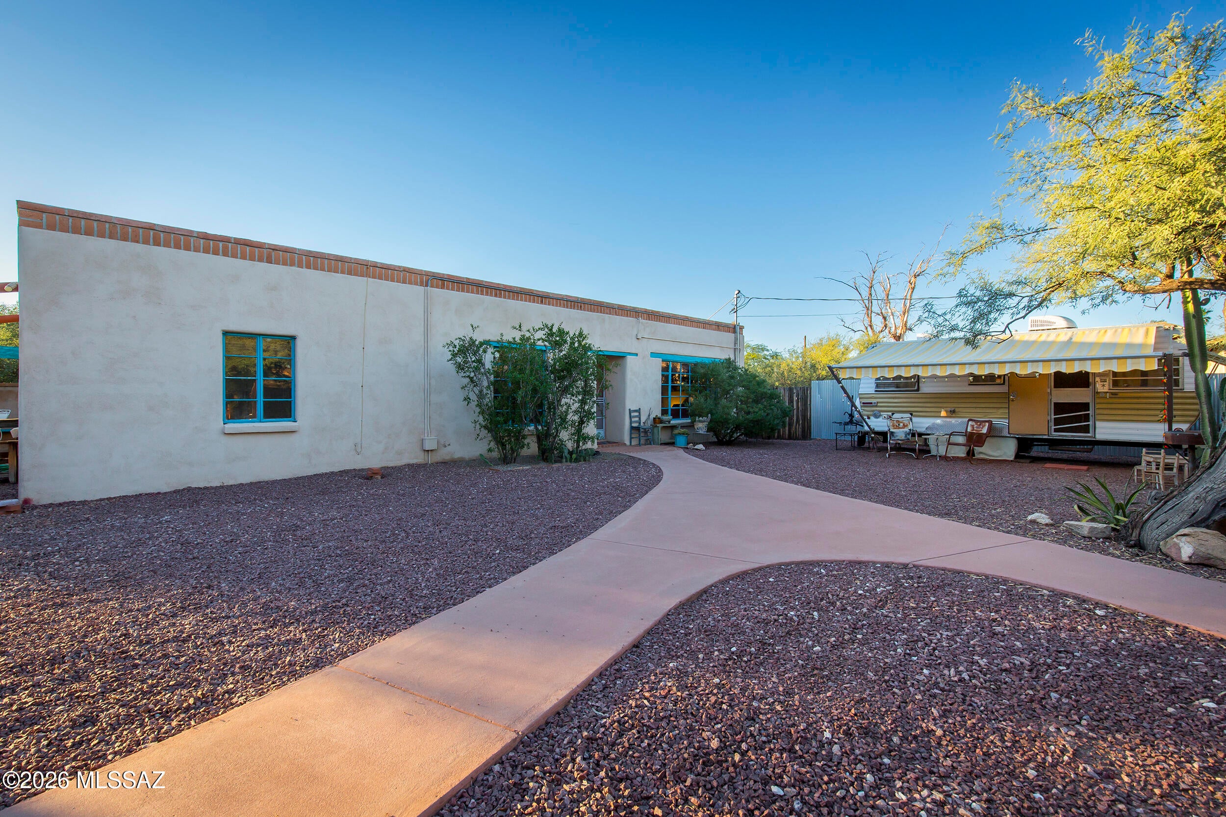 Seller to offer $10,00 credit for consessions or rate buy down with acceptable offer! 1940s historic beauty in Tucson's sought-after Campus Farms area. Well maintained home! Located near UofA agricultural farm, w/ easy access to Mountain Ave and ''The Loop'' bike paths leading directly to the Uni. Spacious territorial offers character, privacy, and flexibility on a large R2 lot. Two bedrooms plus third room for home office. Fully fenced-in yard, jacuzzi, covered back patio + built-in fireplace create inviting outdoor living spaces. Mature desert-landscaped front yard features a circular drive and an RV-height double carport. New Tuff Shed workshop with electricity and air con, along with a charming historic carriage house/ for additional storage or studio space. No HOA and no rear alley add to the peace and privacy of this quiet, picturesque neighborhood.

Be sure to view the 360° virtual tour and floorplan included in the listing. Owner occupied -- please do not enter the property without an appointment.