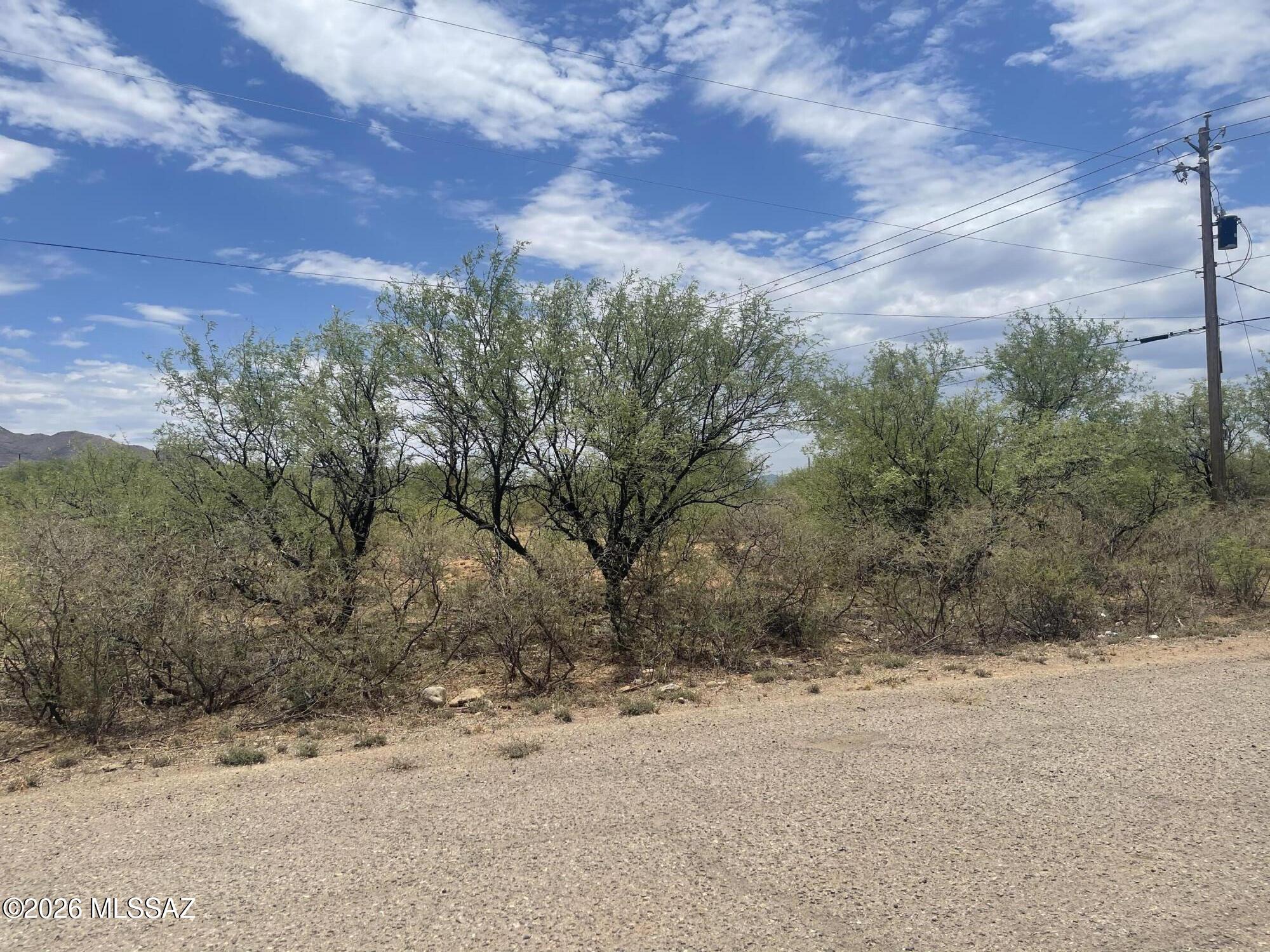 Flat, corner lot with views!  Perfect for building our next home.   Electric and water connections are nearby.  Centrally located and close to shopping areas.   Easy access to the freeway.