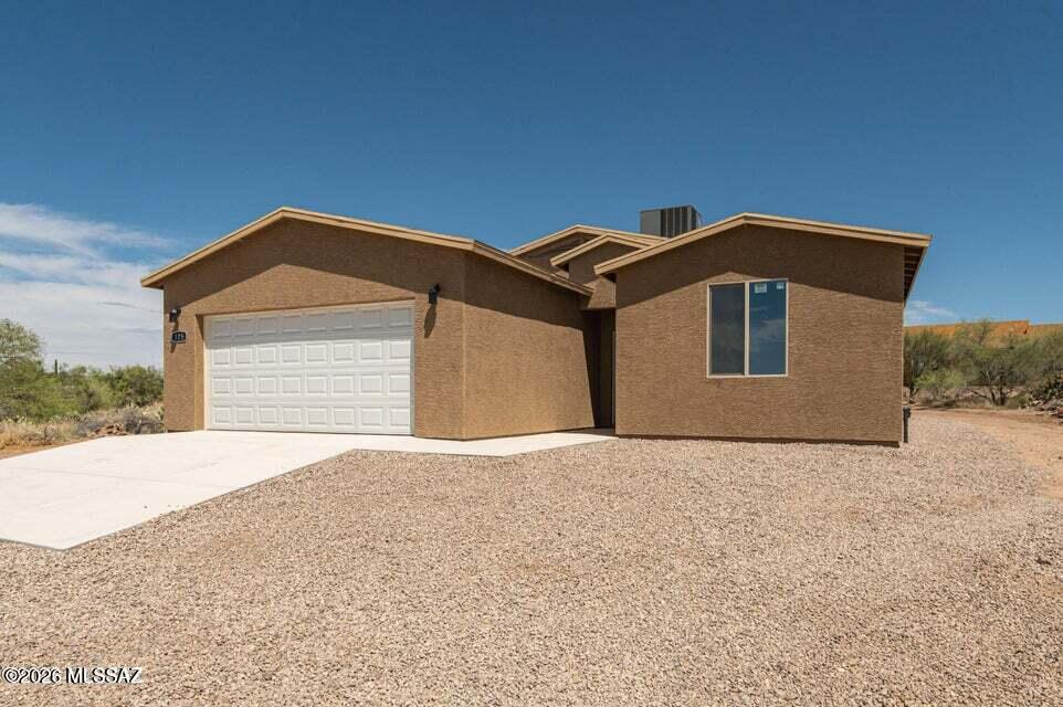 Welcome to this newly built home featuring 3 bedrooms, 2 bathrooms, and 1,506 square feet of modern living space. The open floor plan offers a smooth flow between the living, dining, and kitchen areas, ideal for both daily life and entertaining. Enjoy the convenience of an attached two-car garage and the benefit of no HOA restrictions. Step outside to take in the beautiful mountain views that frame the Tucson landscape. With everything brand new, you can move in knowing the home is ready for you to make it your own. This property is USDA eligible, 0% down financing available!