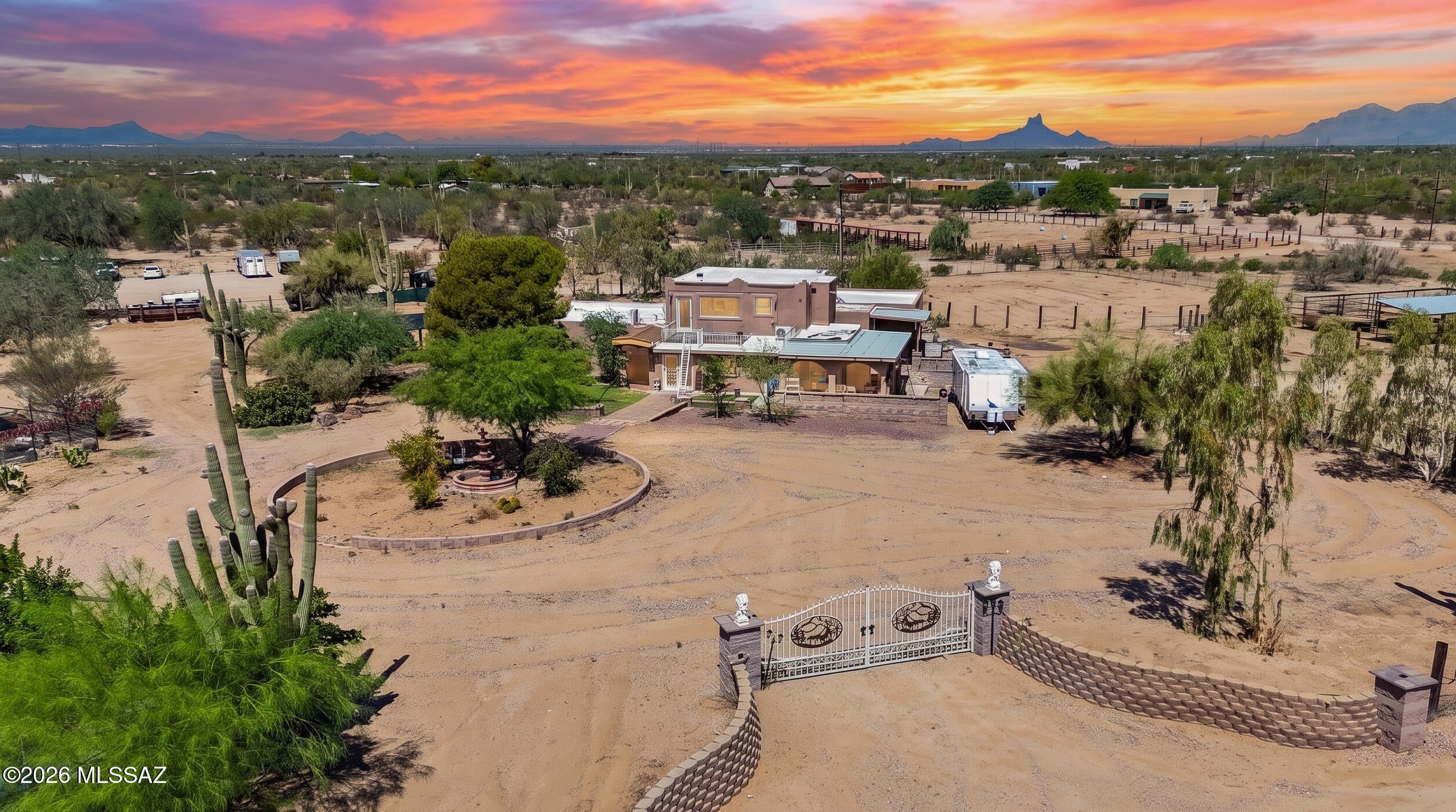 Experience the charm of this 4-bedroom, 3-bath, two-story horse ranch home with a horse stable, set on 5 acres in beautiful Marana with breathtaking 360-degree views. A fence surrounds the home, offering privacy and security, while beautiful mature trees and dedicated areas for gardening create a peaceful outdoor setting. The spacious living room features a pull-down projector screen, perfect for movie nights and entertaining. Enjoy two cozy fireplaces, one in the living room and another upstairs in the primary bedroom. The spacious primary suite also features a private hot tub, creating the perfect place to relax while overlooking the stunning panoramic views. A rare opportunity to enjoy space, privacy, and country living!