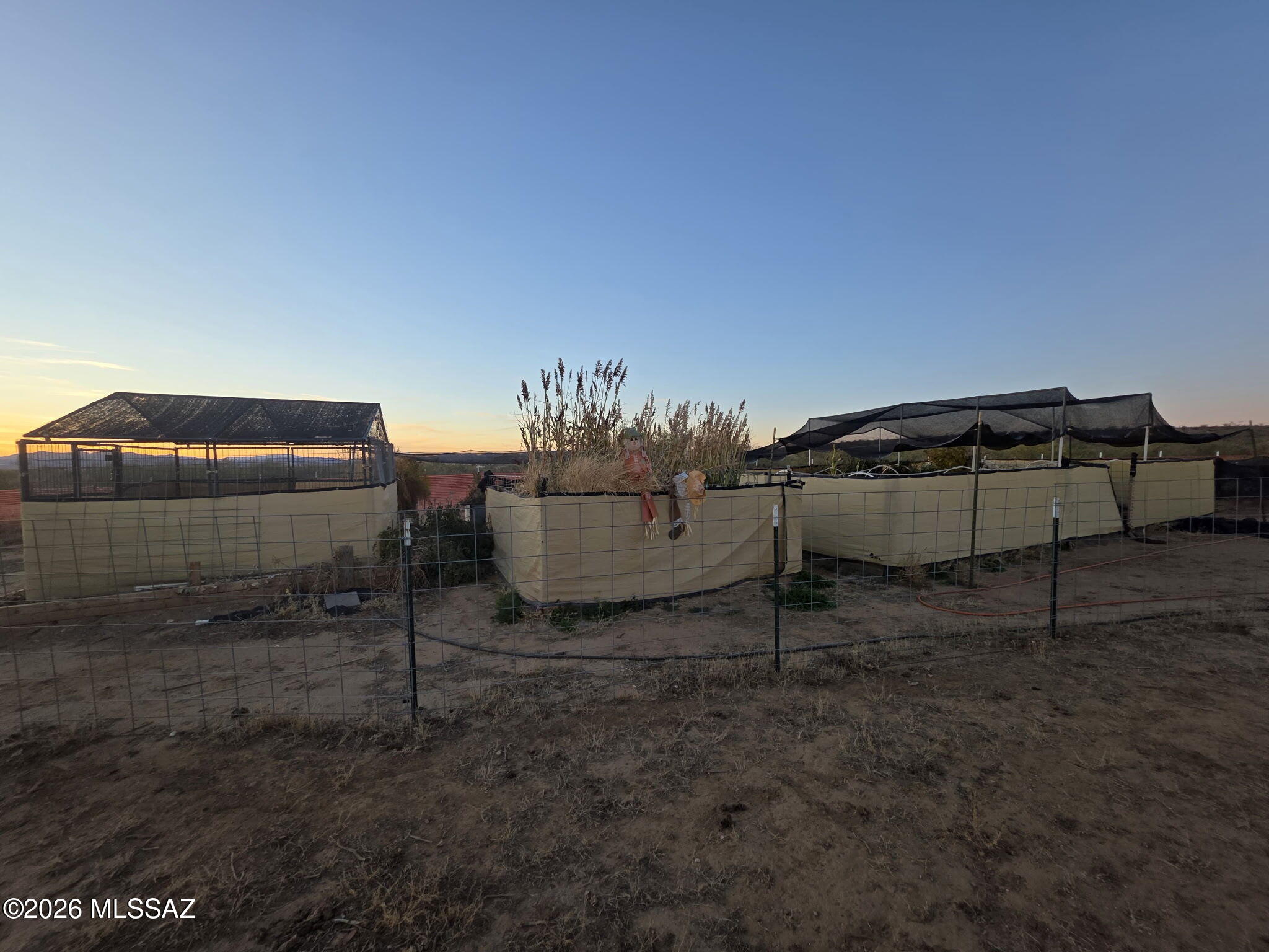 20 acres fully set up for off-grid living, homesteading, or a peaceful desert retreat.

✅ Property Features
• 1 acre cleared for gardening
• Raised beds + 5-year-old trees
• 2 septic systems on each end of property
• Hauled water, two storage tanks with dual pressure tanks.
• Security cameras installed

🏡 All Purpose Structure that has:
• 
• Pellet stove
• Swamp cooler
• Powered by its own solar system
• Tool shed
.  RV Deck