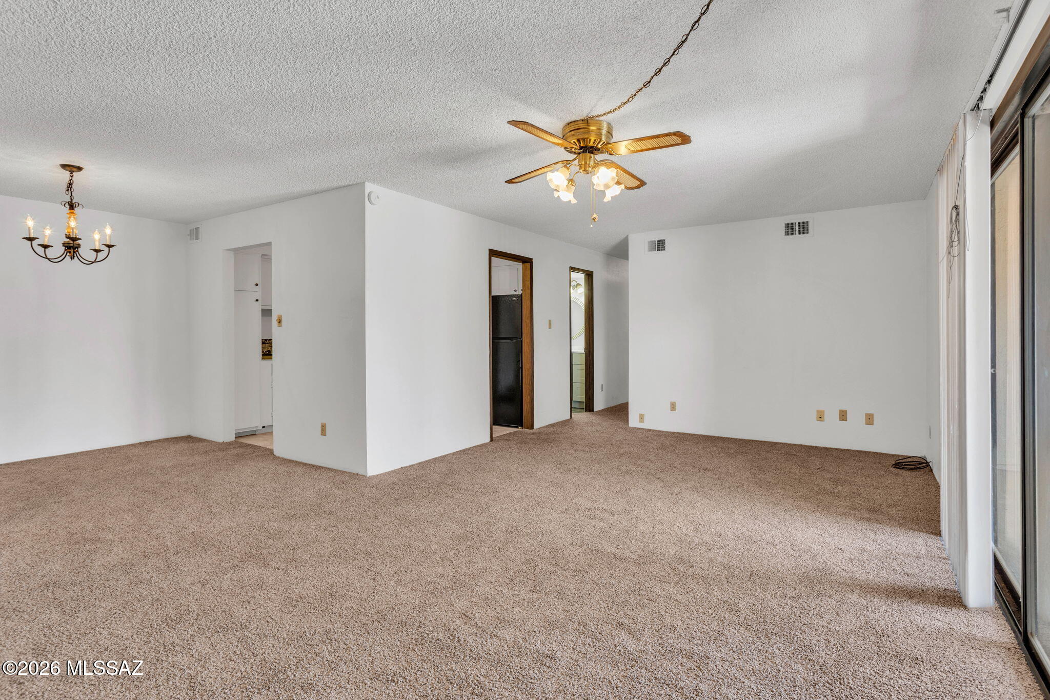 WOW! 1300 sqft 3 bed/2 bath home for $132,000! New carpet, remodeled hall bath, kitchen appliances stay. AC, sun-reflecting window screens, and ceiling fans will keep you cool. Large open-concept living and dining area. Laundry room in the unit.  Enjoy the large, covered balcony and an unexpected ''Juliette'' balcony off the primary suite. Central location close to shopping, bus line, U of A, downtown, and the I-10 freeway. HOA fees are a bargain when you see all that's included. Rentals allowed. Assigned, covered parking space with open parking for 2nd vehicle or guests. Enjoy the 2 community pools and clubhouse available to rent for all your gatherings. This established 17-acre community has room to roam! Bring all offers today!