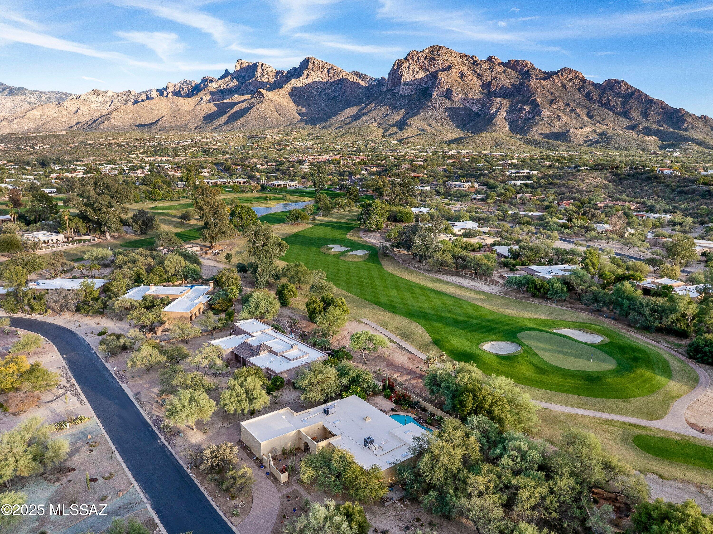 Come escape the cold and enjoy sunny Tucson winters in this vintage Adobe Territorial home on the golf course at Oro Valley Country Club. Perched on one of the community's finest lots, this home boasts breathtaking mountain and fairway views and a backyard that feels like your private desert oasis.
The home offers 3 bedrooms plus a den (optional 4th bedroom) and a large bonus room perfect for a studio, game room, or hobby space. With a golf cart garage and flexible living spaces, it's designed for easy living and entertaining.
Step outside to the sparkling pool, ideal for soaking up the Arizona sun, hosting friends, or relaxing under endless blue skies. Whether you're enjoying morning coffee with mountain views or evening gatherings by the pool, the backyard is truly the heart of this home.
Move-in ready with new carpet, a new roof and fresh interior paint, this home combines classic Stucco Adobe charm with modern comfort.
Just minutes from shopping, golf, and world-class dining, you'll be living in one of the few UNESCO Cities of Gastronomy, with countless acclaimed restaurants and culinary experiences right at your fingertips.
Live the ultimate Tucson lifestyle, poolside relaxation, desert sunsets, golf course views, and sunny winters. This home is your perfect desert retreat, ready for fun, relaxation, and everything in between.