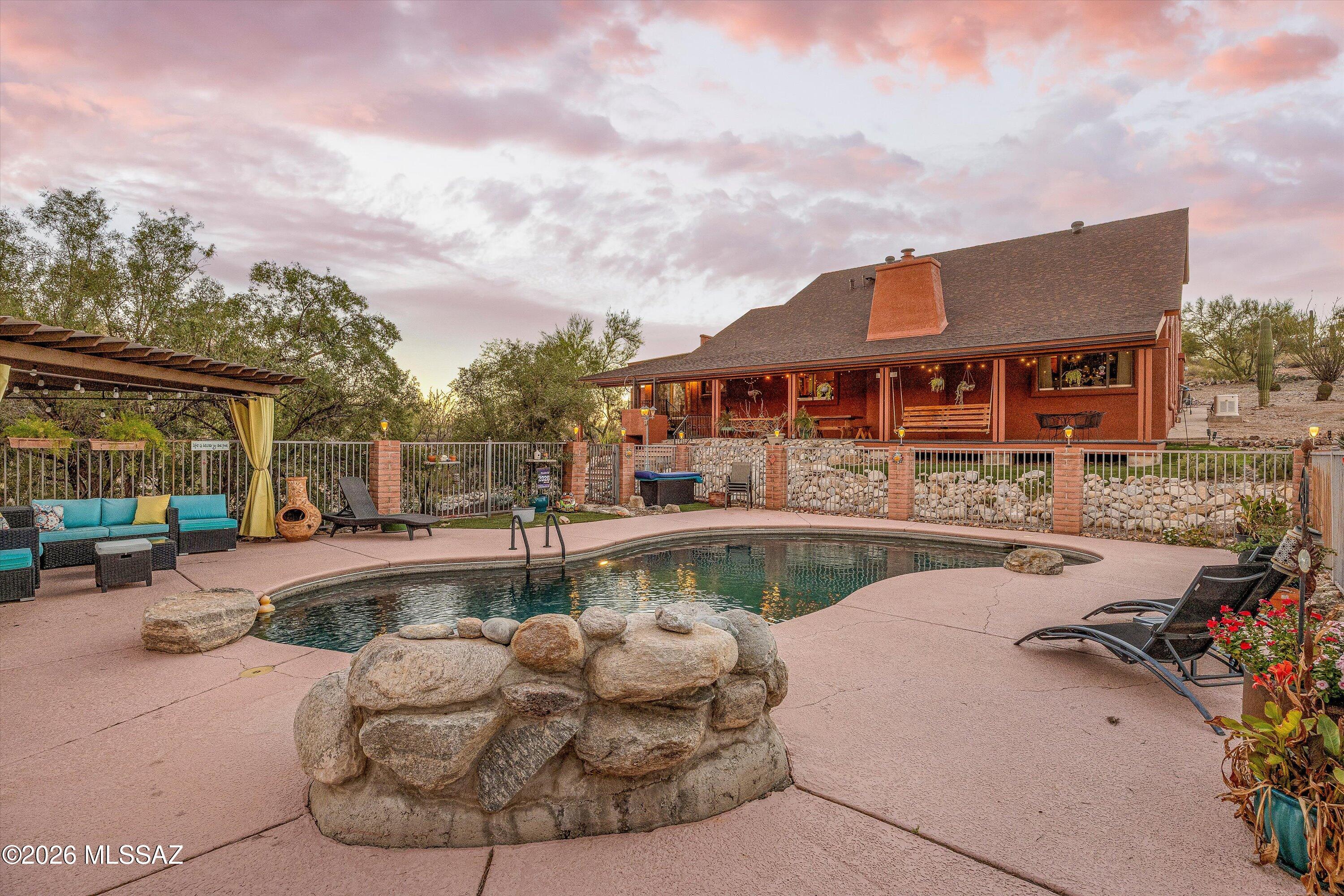 *SELLER WILL CONSIDER OFFERS BETWEEN $699,000-$749,900 & MAY BUY DOWN RATE/PAY CLOSING COSTS* Beautiful, UPDATED, Ridgetop Mediterranean on 1 acre lot w/360 degree VIEWS in Tanque Verde Valley in NE Tucson.  Home is 2-story, split plan & has 3-4 bedrooms, & huge LOFT / 2-1/2 baths. Incredible island Kitchen opens to Formal Dining room & Great room w/Vaulted ceilings & wood burning Fireplace. WOW staircase leads to upstairs Primary bedroom suite w/deck/city views & LOFT/4th bedroom (could make 2 smaller bedrooms). Downstairs is 2 bedrooms/1-1/2 baths. Backyard has a long covered east facing patio w/built in grill, huge swing & separately fenced pool area w/covered ramada. Dream laundry room has 2 washers/1 dryer /pantry & enclosed dog run. Oversized 3-car garage w/workshop. Lots of parking.