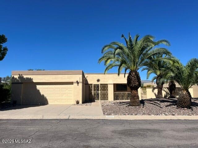 Fantastic Fountain Park home!!  3 bedrooms, 2 baths, stunning open floor plan.  FANTASTIC Catalina Mountain views.  This gorgeous home backs up to a riparian area by a natural preserve/common area as well as the pool/park and walking trails.  The street dead ends 1 home west of this home.  Super private & low traffic.  Beautifully tiled and carpeted, eat-in kitchen, large breakfast bar and loads of cabinets.  The natural gas fireplace can be seen from the living room and formal dining room.  Walk-in closets in each of the large bedrooms, plus a full wall of closets in the Primary Bedroom.  Six (6) ceiling fans inside and two (2) on the oversized east patio where you can enjoy the commanding Catalina Mountain views and evening sunsets.  Not to mention the hummingbirds and butterflies.  The covered patio is approximately 20? X 30?.  New HVAC system in 2025.  Roof recoated 2026.  Wrought-iron and much of exterior was repainted 2026.