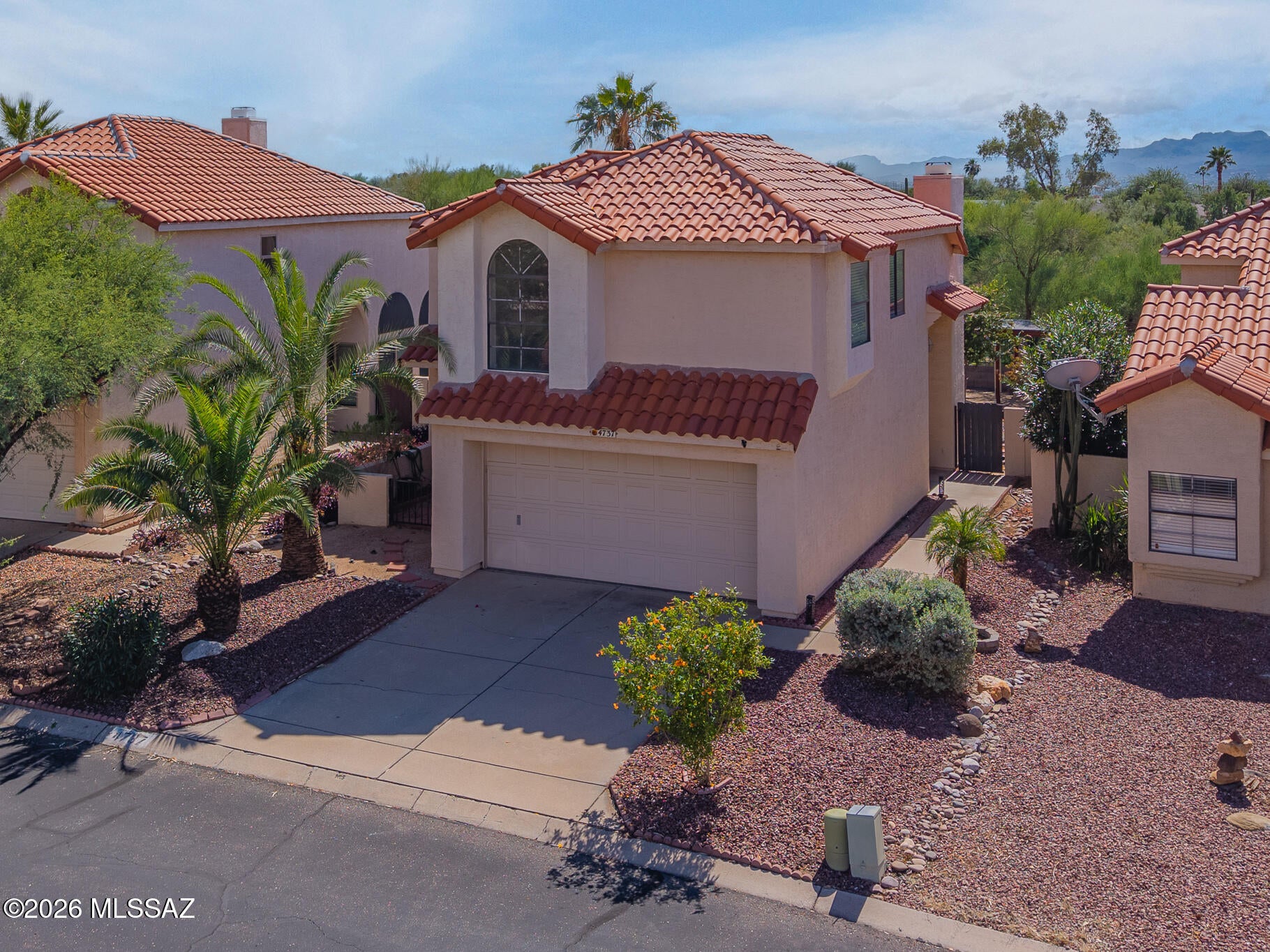 Welcome to this charming 3-bedroom, 2.5-bath home located in the desirable gated Countryside community in Northwest Tucson! Offering 1,329 sq. ft. of living space, this two-story home features an inviting open-concept floor plan, abundant natural light, and a cozy fireplace in the great room. The spacious kitchen flows seamlessly into the dining and living areas, perfect for everyday living and entertaining. Upstairs, the primary suite offers a walk-in closet, dual vanities, and a relaxing soaking tub. Step outside to a private backyard with no rear neighbors, open desert surroundings, and mountain views. Enjoy access to fantastic community amenities, including a pool, spa, parks, playgrounds, and recreational facilities. Complete with a two-car garage and conveniently located near shopping, dining, and I-10, this home offers a wonderful combination of comfort, convenience, and Northwest Tucson living!