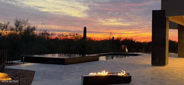 Recently completed new construction overlooking the 17th green of The Gallery North Golf Course, with sweeping views of the Tortolita Mountains from the front of the home.  Thoughtfully designed and impeccably executed, this refined desert modern estate showcases meticulous attention to detail throughout.

The residence offers 4 bedrooms, 4 full bathrooms, and a dedicated office or optional guest bedroom, delivering both functionality and flexibility. A gourmet kitchen anchors the home, featuring Dacor appliances, custom cabinetry, and premium finishes--ideal for both everyday living and elegant entertaining.

Located within the gated Gallery Community, this home combines privacy, architectural excellence, and a premier golf course setting, all just