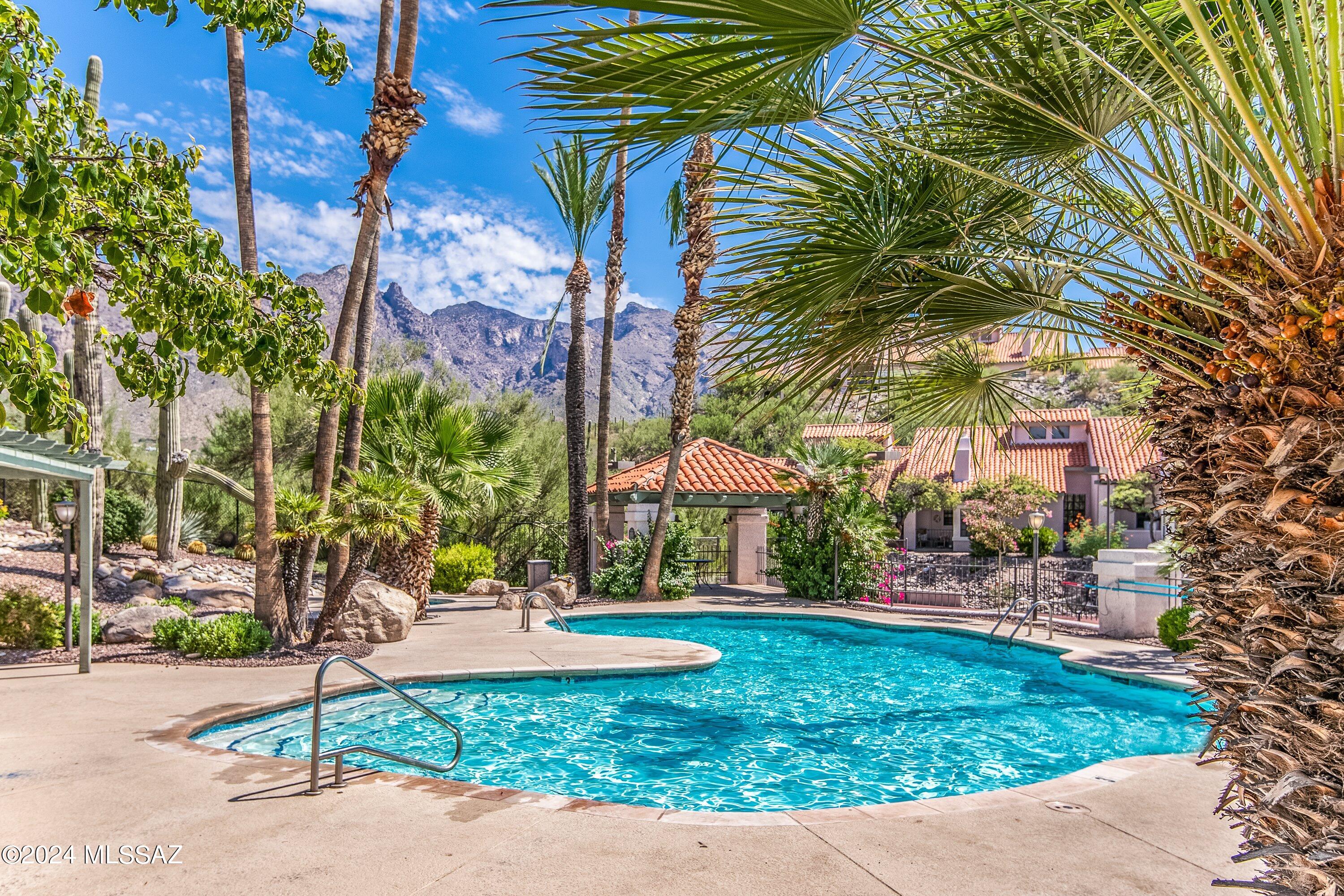 Spacious fully furnished ground floor one bedroom condo in the popular resort style community of the Tierra Catalina Condos.  This private Northern Tucson property is available completely turnkey and features remodeled kitchen with stainless steel appliances, cozy wood burning fireplace, covered patio with Rincon Mountain views, secluded primary suite with roomy walk-in closet, freshly painted throughout and a convenient Catalina Foothills location near La Encantada Mall.  The Tierra Catalina Condos include a heated pool & spa, tennis / pickleball court, gym, BBQ grills and clubhouse. This condo is currently being used as a successful short-term rental and is being sold completely turnkey, everything in the condo stays with the property.