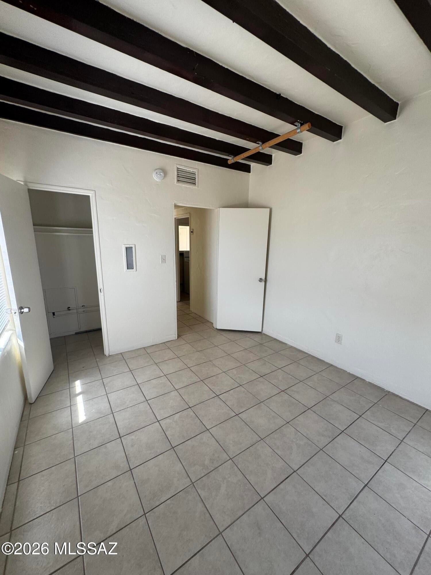 2480 N. Martin Street. Duplex near Campbell/Grant with 2 bedrooms/1 bath. Covered patio and private fenced yard on corner lot. Lovely wood beam ceilings in living room and bedroom.  1 block west of Campbell just north of Grant. Evaporative cooler. No Pets.  1 car garage for tenant use.