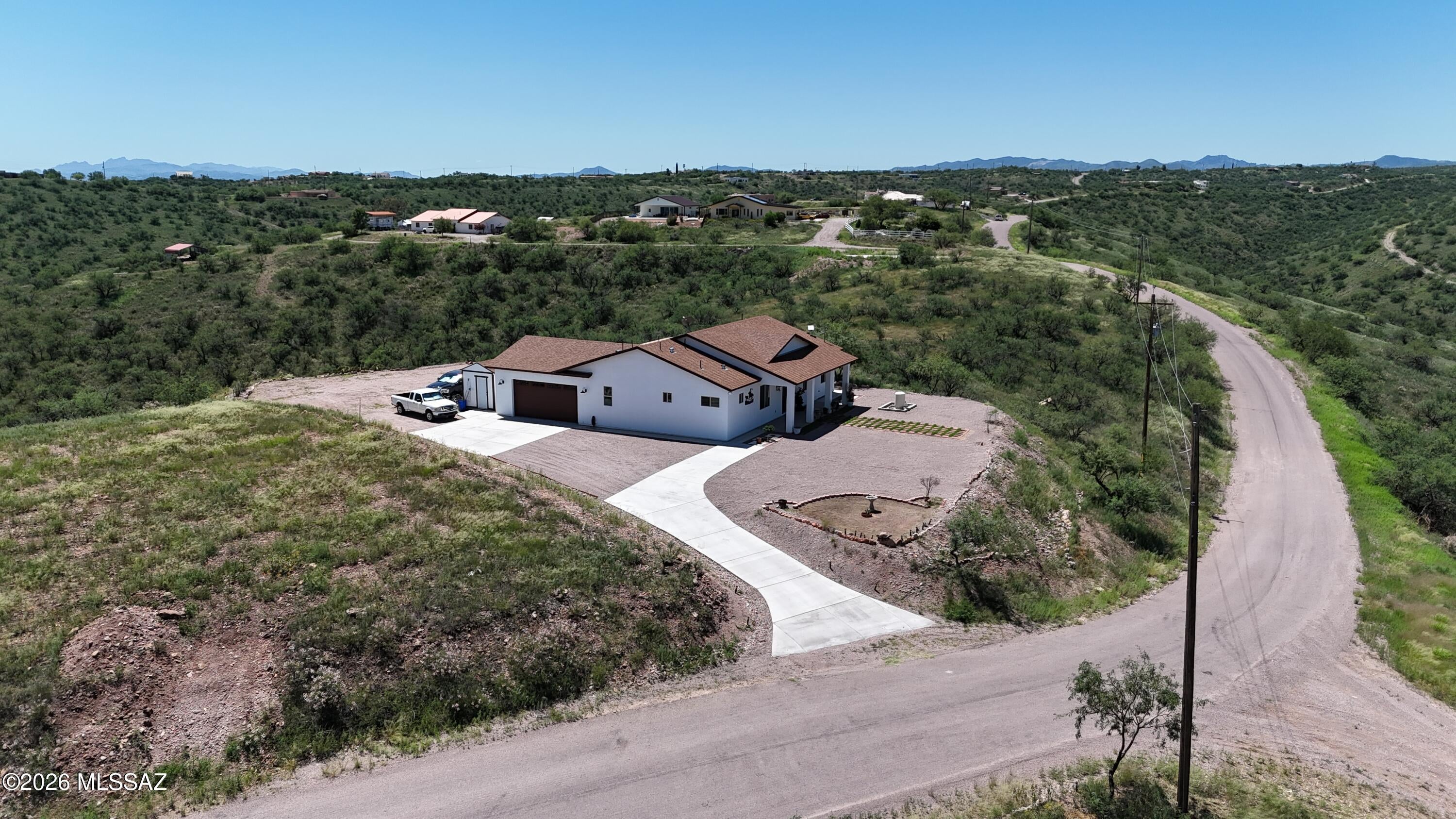 One of a kind custom built home on a gentle hill with 360 degree views.   Amazing attention to detail, lovely owner's suite plus another of the 3 bedrooms had it's own on-suite bathroom.  Split floorplan, expansive great room, huge kitchen island with cabinets, lazy Susan cabinets upper and lower, all drawers and cabinets have ''soft close''.  Convection oven, microwave, electric cooktop, refrigerator and dishwasher all matching stainless steel by Frigidaire.  Undercabinet LED lights, pendant lights and recessed lights.  Butlers Pantry with huge capacity.  Lot's of storage throughout.  Insulated oversized garage with built in workbench and anchored metal cabinets will stay with the home.  Super high efficiency 5 ton Bos HVAC.