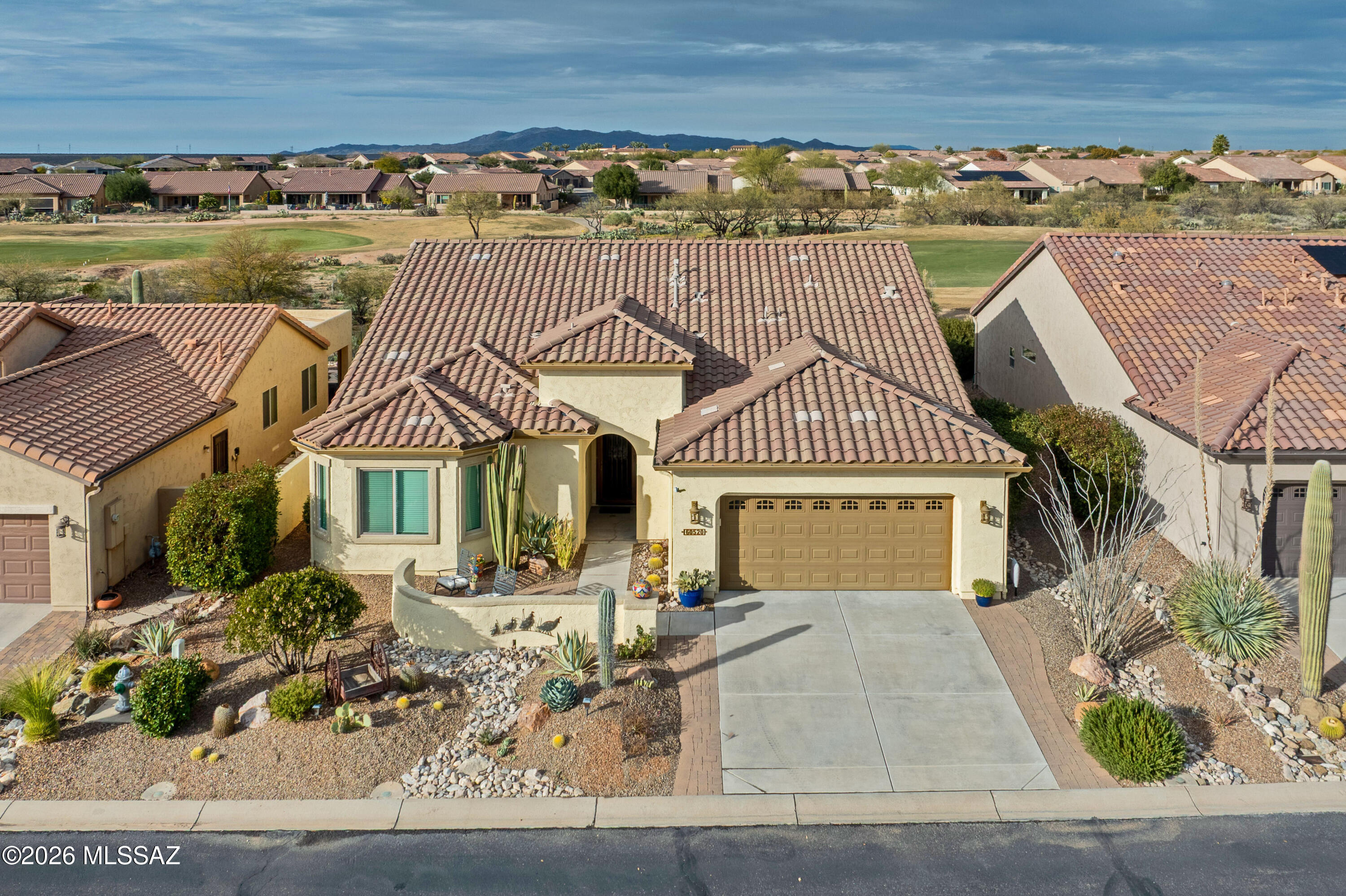 A beautiful Artesa Model that backs up to the 11th Fairway of the SaddleBrooke Ranch Golf Course. The home consists of a Extended Master Bedroom with Walk-In Closet, door to covered patio, dual vanities, and a large Walk-In Shower; Extended 2nd Bedroom, Great Room w/Media Alcove; Dining Area with Glass Slider to access the back yard; 2-full Bathrooms; Den or Office; Extended 2-car Garage with Golf Cart Space; Laundry Room with Sink and Storage; and Owner's Valet. The kitchen features granite counters and new LG appliances, including the refrigerator, range, and dishwasher. The front yard is fully landscaped w/mature plantings with lights and drip irrigation, a front courtyard and a custom-made security screen door.  The backyard has a large Covered Patio with Tucson Rolling Shades, a cobblestone patio that extends out into the yard with mature plantings, a fire pit, and that all backs up to the 11th Fairway on the SaddleBrooke Ranch Golf Course!