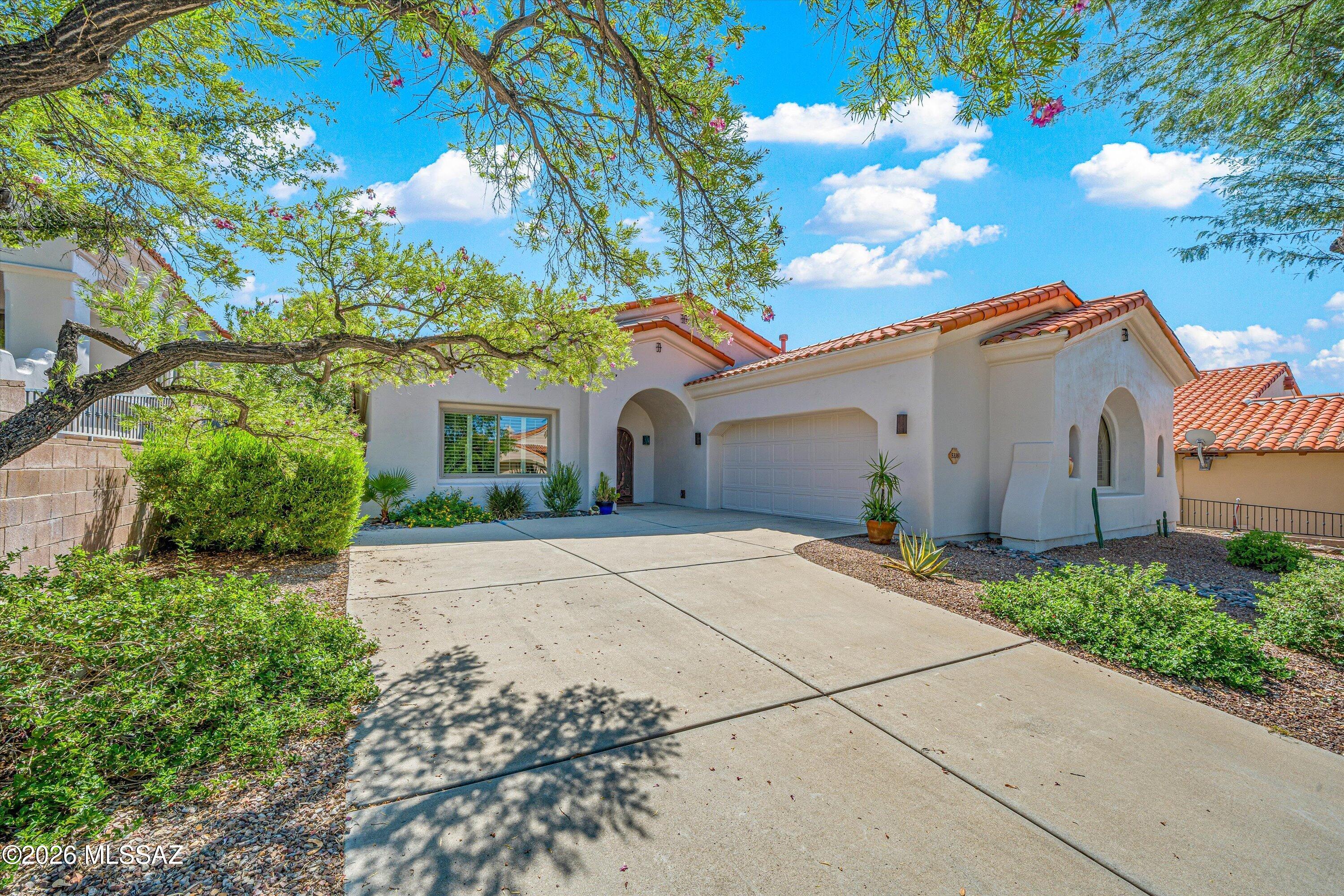 Enjoy Tucson living at its finest in this beautiful home within the gated Sabino Springs community, home to the Arizona National. The spacious floor plan features a great room with new flooring, a versatile den, and a well-appointed kitchen with a large island, gas range, prep sink, and abundant countertop space. The backyard is an entertainer's dream, showcasing expansive views, private outdoor living space, and a large heated spool perfect for relaxing year-round. Recent upgrades include a newer HVAC system and furnace (2024). With stunning views, thoughtful updates, and exceptional indoor-outdoor living, this home offers the perfect blend of comfort, style, and Arizona living.