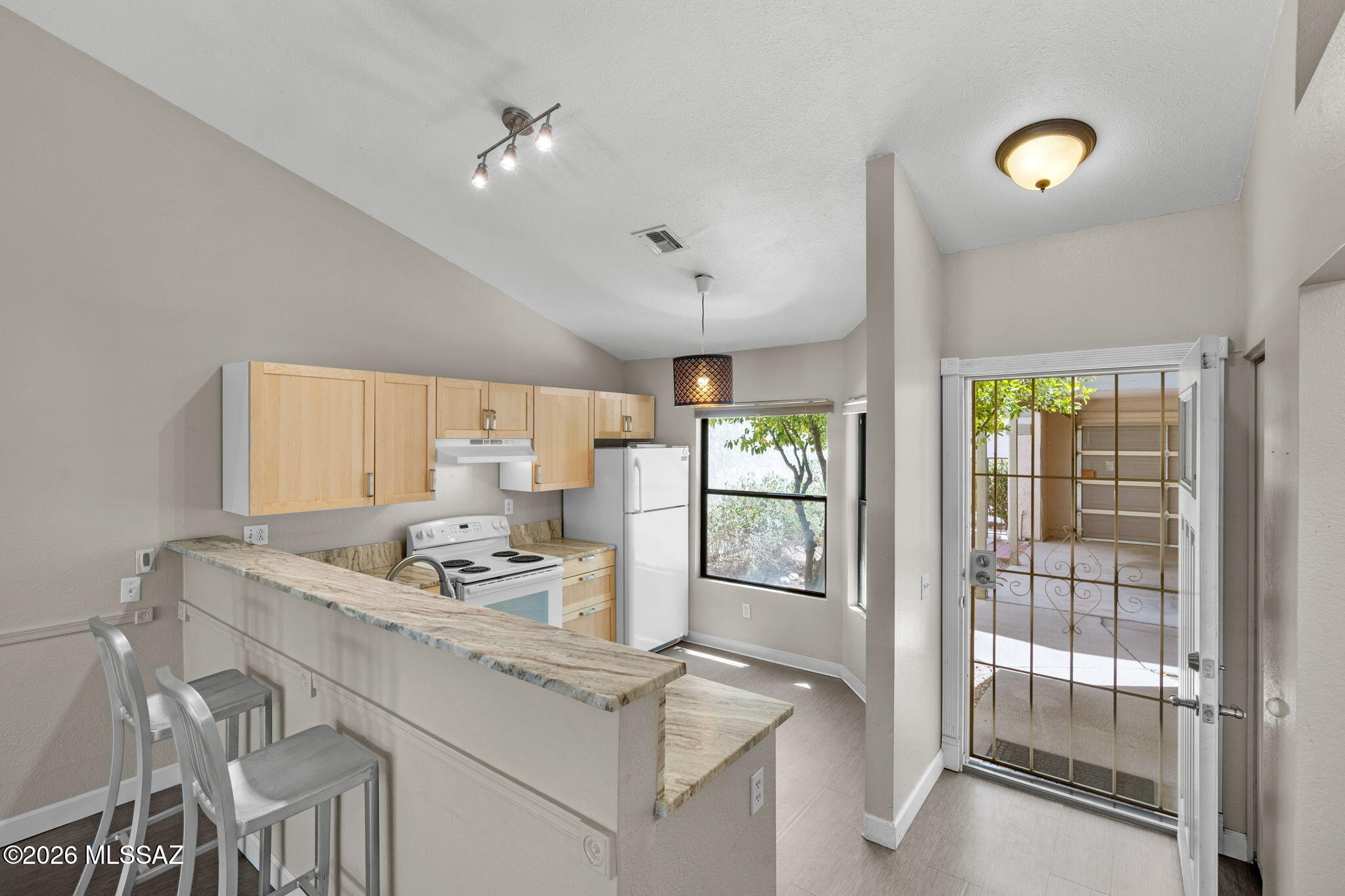 Charming 2-bedroom, 2-bath home in a highly desirable Northwest location. Ideally situated near shopping, golf, and top-rated schools, this end-unit offers both comfort and convenience. Features include beautiful luxury vinyl plank flooring, updated countertops, and a relaxing jetted bathtub. Brand new washer and water heater. Located just steps from the community pool, this property is perfect as a starter home, seasonal retreat, or investment opportunity.