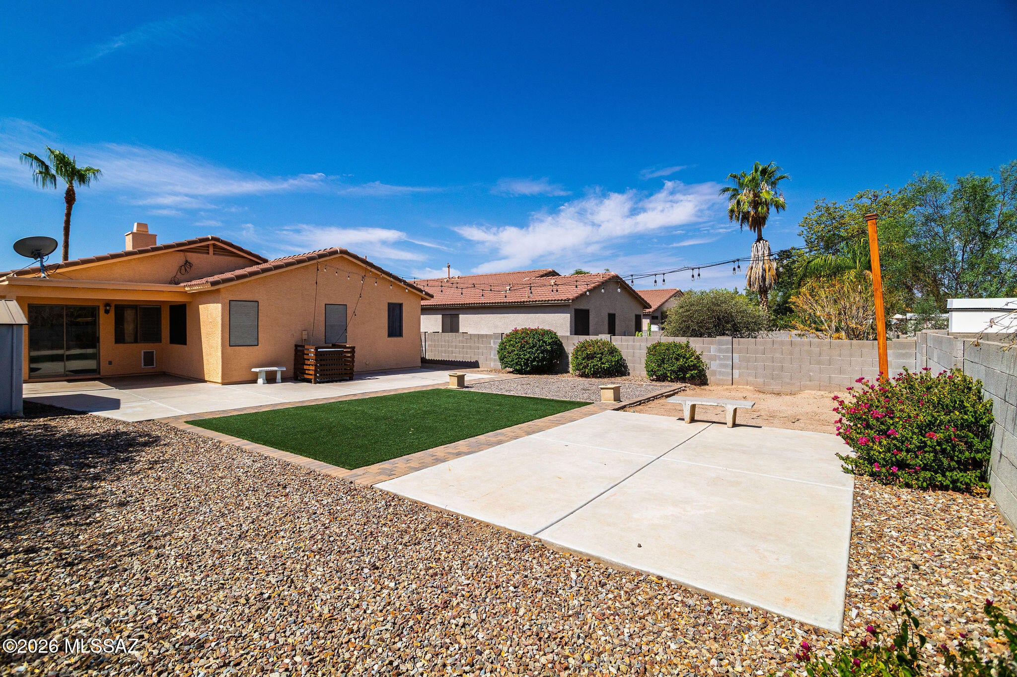 Incredible location! Situated on a cul-de-sac lot this is a great location offering a 3 bedroom, 2 baths, new carpet, new paint on exterior and interior, tiled plank flooring, plus newly painted cabinetry in kitchen and bathrooms. Enjoy the flexible floor plan! Wonderful space in the front formal living and dining room, plus you have a family room off the kitchen! Use these spaces as they were designed OR use the front for a large living room and turn the family room into a dining space off the kitchen - tons of options for your lifestyle! Home is complete with faux wood blinds, decorative niches and ceiling fans throughout the home. This large kitchen features an island with a gorgeous butcher board countertop with cabinets and bar seating for four. Additional features are a Granite composite sink with an upgraded pull-out black facet and designer hardware. Appliances are black stainless offering a gas range, microwave, dishwasher and refrigerator plus a pantry closet for extra storage!

Spacious primary suite; the primary bath features a walk-in shower, a double sink vanity, soaking tub with built-in shelving for towels and a walk-in closet.
Family room offers a wood burning fireplace plus lots of natural light throughout. The sliding glass door leads you to the covered patio offering incredible outdoor living! The extensive concrete allows for a future outdoor kitchen or dining area plus landscaped with artificial turf, brick pavers, a sand pit for kids play area and additional concrete pad for lounging or games!

Laundry room is designed with upper cabinet storage, wall-to-ceiling subway tile plus custom open shelving. AND the garage has space for a workbench!

Don't miss out on this home!! Call for your showing today.