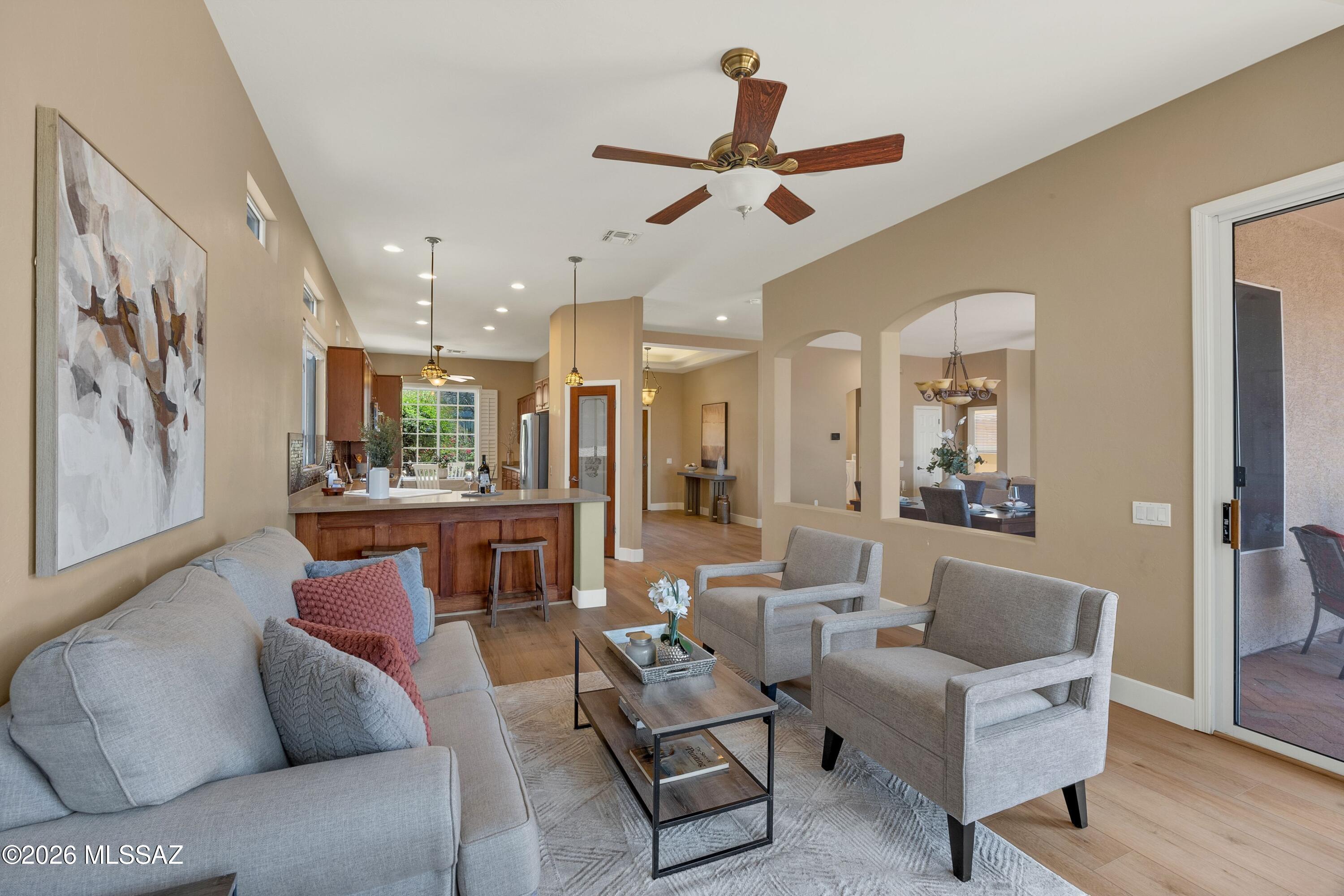 Located in The Highlands at Dove Mountain, a Premier 50+ Active Adult Community on a Championship Arthur Hills Golf Course, this Extensively Updated Home Offers an Excellent 1,953 SF Floorplan w/ 2 Bd/2 Ba & Separate Living & Family Rooms for Flexible Living. Easily Adaptable for Accessible Living. Upgraded Throughout w/ Brand New ''Harvest Hues Oak'' Vinyl Plank Flooring, a Beautifully Appointed Kitchen w/ New GE SS Double Oven, Microwave & Dishwasher, Corian Countertops, Cherry Cabinetry, Custom Tile Backsplash, Pantry & Multiple Dining Options Including a Nook, Breakfast Bar & Formal Dining Area. Major Improvements:  a Rebuilt 25 SEER HVAC, Newer Water Heater, Radiant Barrier Insulation w/ Solar Roof Fans for Enhanced Energy Efficiency & a Full-Home Pelican Water Filtration System! The Full-Home Pelican Water Filtration System Treats Water at the Point of Entry, Delivering Clean, Filtered Water to Every Faucet - Reducing Chlorine, Chemicals & Sediment for Improved Taste & Water Quality While Helping Protect Plumbing, Fixtures & Appliances w/ a Low-Maintenance, Energy-Efficient Design.  

The Home Has an Added Layer of Protection Against Water Damage, w/ Two Upgraded Shut-Off Controls Installed in 2015, Enabling House Water Cut-Off While Leaving Irrigation Operating Independently.

The Spacious Owner's Suite Offers Peaceful Backyard Views, Patio Access, Dual Vanities, Soaking Tub, Walk-In Tub & a Custom Organized Closet. 

A 2-Car Garage w/ Golf Cart Space, Built-In Cabinetry & Workbench Adds Functionality. Rebuilt Insulated Garage Door in 2024 w/ Belt Drive System, New Main Springs, New Hinges & All New Hardware.

Enjoy Inviting Outdoor Living w/ a Charming Front Courtyard & a Private Backyard Featuring a Brick Patio, Built-In BBQ, Mature Landscaping & Producing Citrus--Perfect for Relaxing or Entertaining in a Quiet Desert Setting.

Dove Mountain Is a Premier 6,200+ Acre Golf Resort Community in the Sonoran Desert Offering 50+ Miles of Hiking & Biking Trails, Parks, Sport Courts, Dog Parks & Scenic Walking Paths.