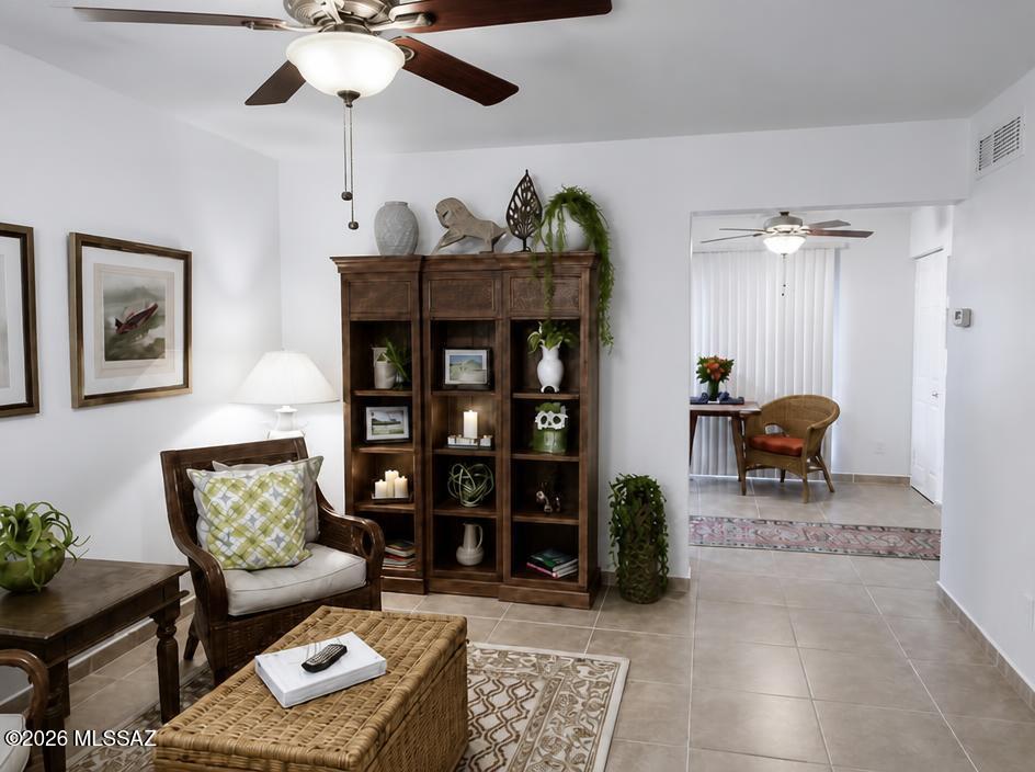 Updated and move-in ready condominium in a gated community offering 575 square feet of comfortable and efficient living space in a convenient central Tucson location. Upgrades include tile flooring throughout, dual pane windows, granite countertops, in-unit laundry connection, fresh interior paint, and a landscaped, fenced rear patio that provides a private outdoor living area. The functional floor plan living with an assigned covered parking space, making this an excellent option for a primary residence, seasonal home, or investment property. Conveniently located near shopping, dining, medical facilities, University of Arizona, public transportation, parks, Tucson Bike Loop and other Tucson recreational  amenities.
