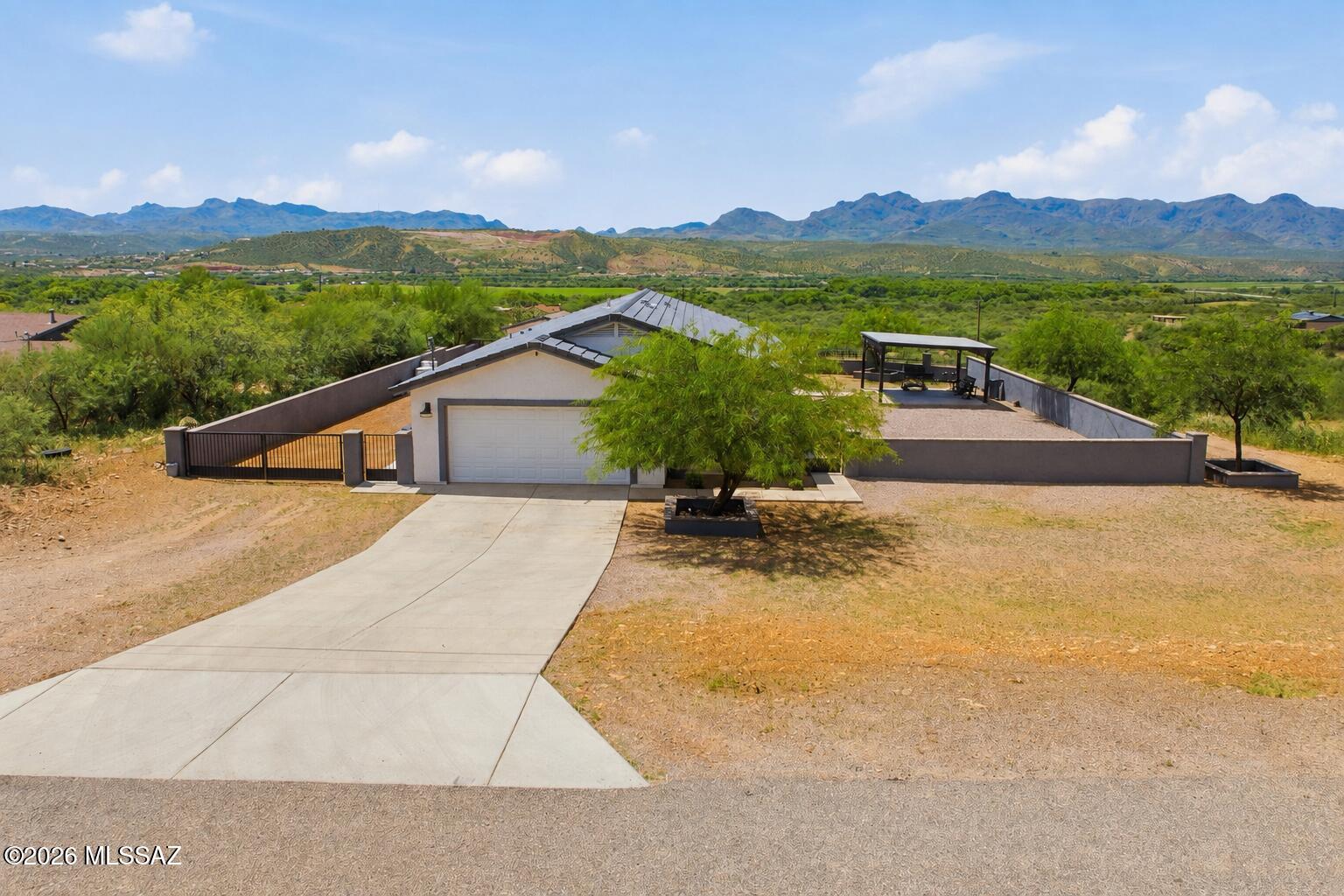Discover the perfect blend of privacy, space, and breathtaking views in this Rio Rico gem. This spacious 4 bedroom home sits on a large, fenced lot, offering peace of mind for children and pets to play safely while you enjoy the beauty of Southern Arizona. Conveniently located with easy access to Interstate 19 and major roads, you'll enjoy both tranquility and everyday convenience. Take in the spectacular mountain views and those unforgettable sunsets from your backyard ramada, the perfect place to entertain, relax, or just enjoy your morning coffee. Plus a large storage shed provides plenty of space for tools, equipment, even hobbies, adding even more functionality to this incredible property. Come experience the space , and lifestyle that makes Rio Rico such a wonderful place.