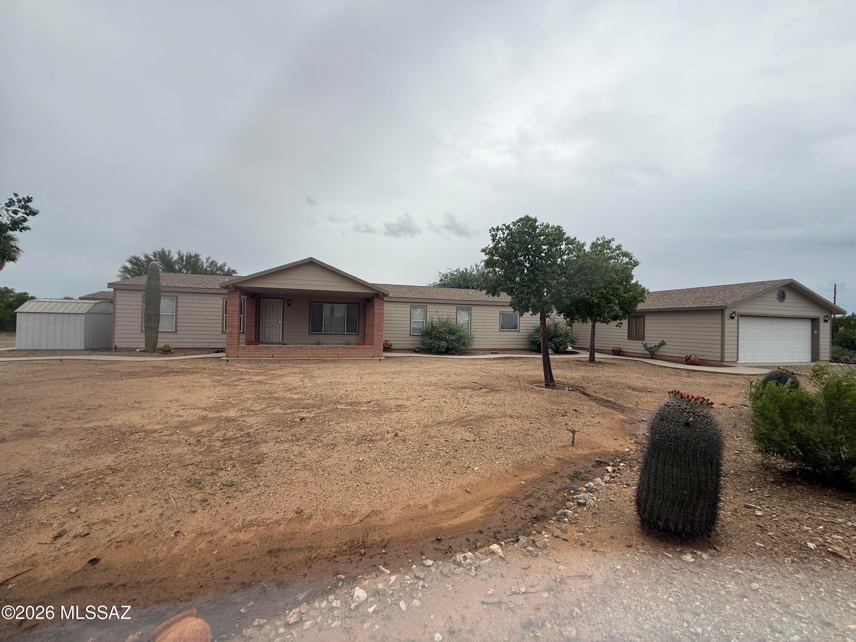 Wonderful opportunity to own this 4.21 acres horse property with so much space. The home is a beautiful 2004 manufactured home offering 4 good size bedrooms and 3 full bathrooms and a large covered patio to enjoy the views from. Front door opens to formal living room and formal dining, the kitchen offers lots of cabinets, an island and spacious breakfast bar. Large family room with gorgeous fireplace is inviting. The master bedroom and large bathroom offers a soaking tub and separate shower. There's a detached 24ft x 30ft garage. The storage container on property does not convey. Property is being sold As-Is but in great condition and it includes all appliances; it is move-in ready. Roof is about 2 years old and AC was replaced about 3 years ago. Don't wait, come see your new home today!