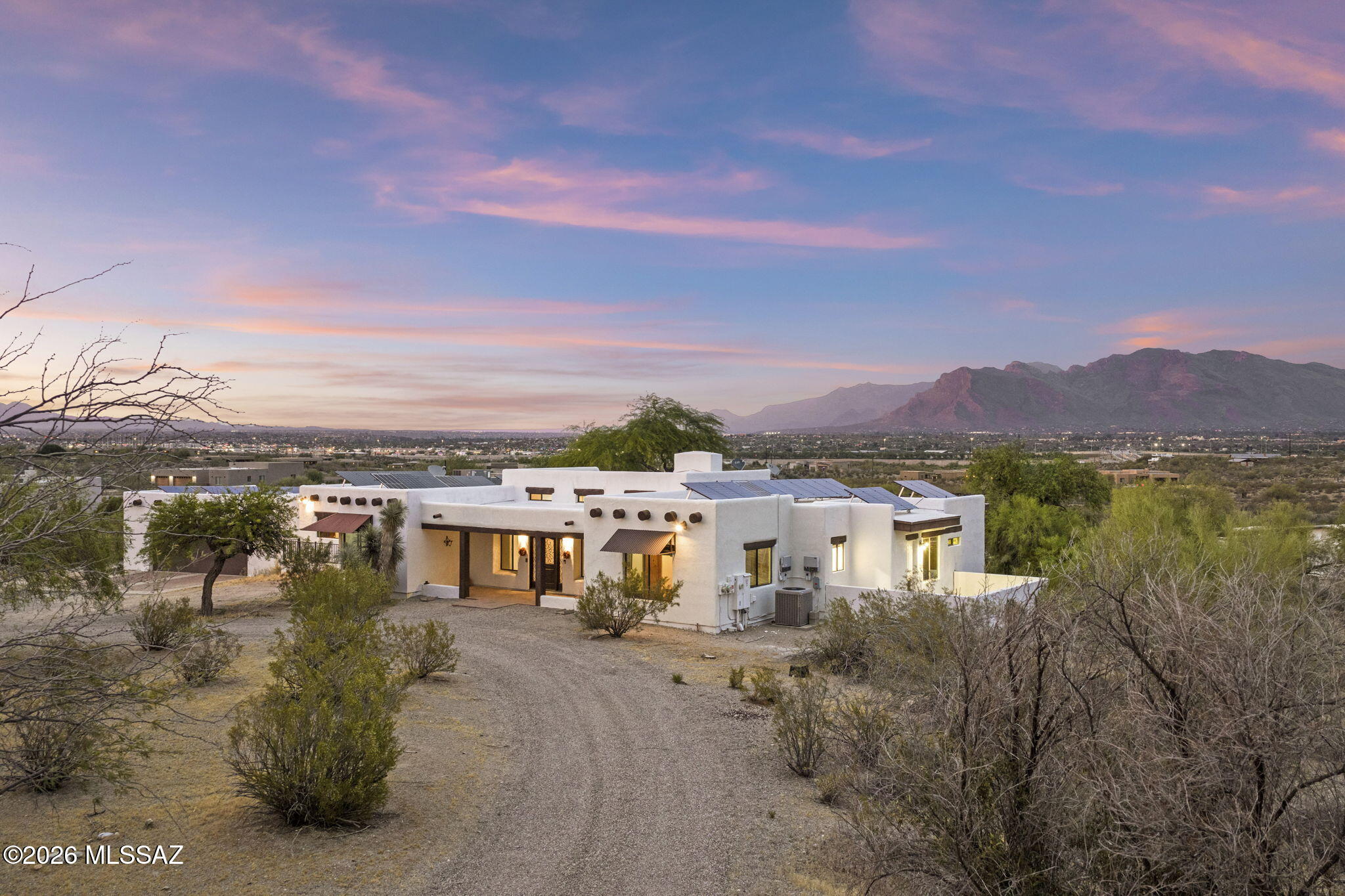 Rare. Refined. Ready. Custom Spanish Equestrian Ranch on 5.57 acres. Tucson Mountains Corridor. No HOA. No compromises. Bring your horses and move right in. Modern barn with four oversized stalls, shaded center walkway, and tack room. Mare motel with connected turnout pens. Round pen, hay barn, chicken coop, concrete wash rack with hitching post, cattle pen, stripping chute, return alley, and roping arena with lights and sprinkler. Over 4,500 sq ft of outbuildings including a 1,375 sq ft workshop with two car garage door and dual RV hookups. Shared well. Solar lease paid in full. Soaring clerestory ceilings, exposed wood beams, remodeled Spanish interior, spa level primary shower, clawfoot tub, pebble tec pool, and Catalina Mountain views. The ranch of your dreams with a home to match. Easy access to I-10 and the newly built Sunset Links overpass. If you know horses you know how rare this is. A fully operational equestrian ranch where every detail was thought through and every dollar was spent with purpose. This is not a property you build overnight. This is a property you spend decades assembling. And it is all here waiting for you.
The land sits elevated at the home and rolls down naturally toward the arena and equestrian facilities below. Which means from your pool deck and living room you have an unobstructed view of the Catalinas on one side and your entire operation laid out in front of you on the other. You can watch hot air balloons from your kitchen window. That is not something you find twice.

The arena is extra length with lights, sprinkler system, stripping chute, return alley, and dual gated trailer access. The 1,760 sq ft barn is purpose built with four private stalls, property features turnout pens, mare motel, 50 ft round pen, hay barn, concrete wash rack with hitching post, cattle pen, and automatic waterers throughout. The 1,375 sq ft multi use workshop has a two car garage door, dual RV electrical hookups including 30 amp and 50 amp, built in shelving, and real conversion potential. Shared well with recorded water agreement. Solar lease fully paid with approximately ten years remaining.

Then there is the home. Custom Spanish architecture with soaring clerestory ceilings, exposed wood beams, tongue and groove planking, and Saltillo tile throughout. Fully reconfigured gourmet kitchen with butcher block island. Spa level primary shower with full Spanish tile, bench, and glass block. Clawfoot soaking tub in the secondary primary. Pebble tec pool. Fire pit. Outdoor kitchen. No carpet. No shortcuts. 

See attached features and upgrades list for full detail.