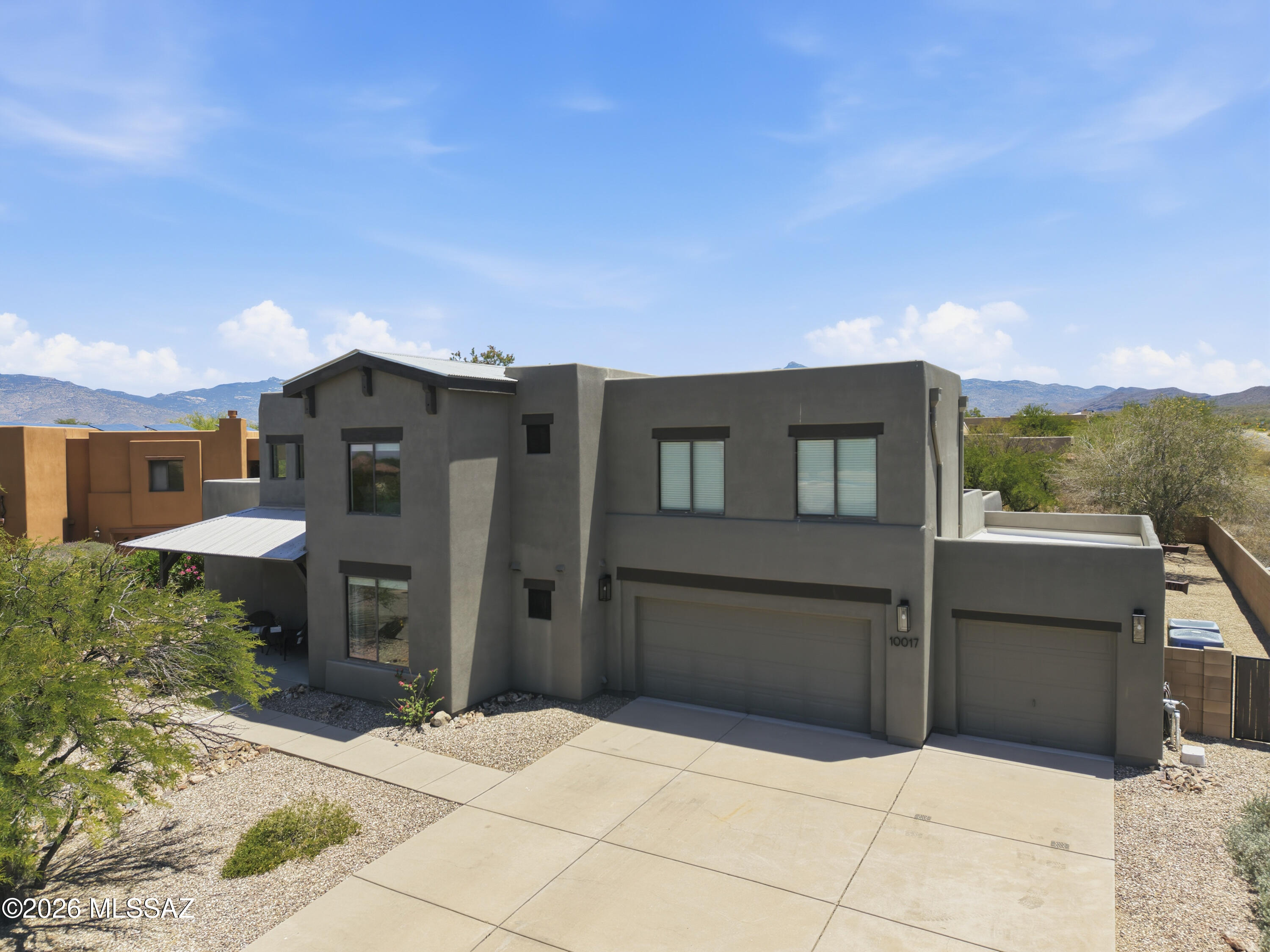 This beautifully renovated home offers the perfect blend of style, space, and functionality. The updated kitchen features quartz countertops, tile backsplash, gas cooktop, double ovens, and SS appliances. Enjoy new flooring, remodeled bathrooms, fresh interior and exterior paint, and new blinds throughout. The living room showcases a cozy gas fireplace, while a bonus room currently used as a theater adds flexible living space. The primary suite is conveniently located on the ground level, with three additional bedrooms upstairs and a rooftop patio with soaring views. Outside, the oversized backyard features a sparkling pool, built-in BBQ, mature landscaping, and citrus trees. Situated on a corner cul-de-sac lot, this move-in ready home truly has it all. Located in the Vail School District.