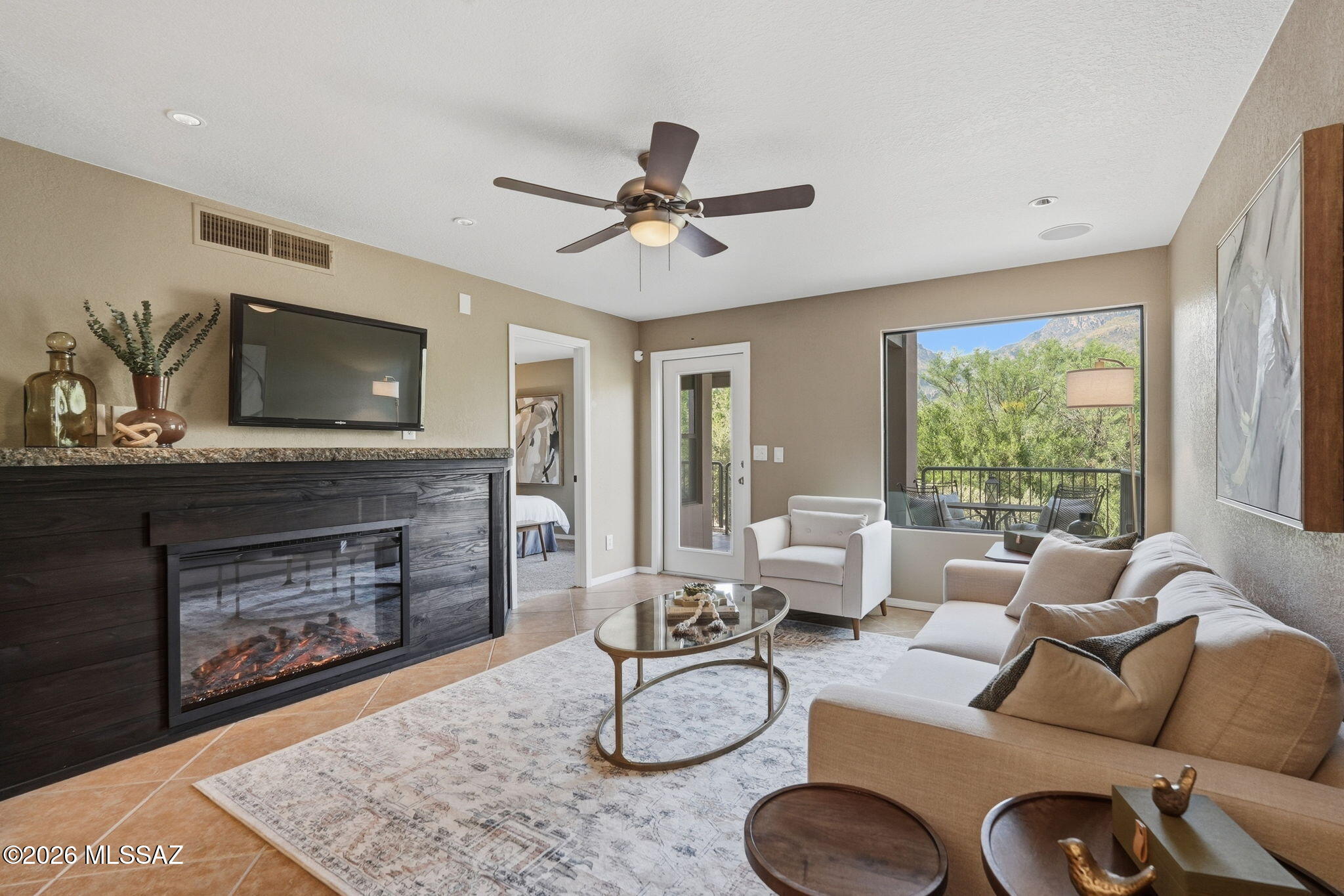 This condo is just special. Great location, luxurious views, 2 bedrooms, 2 baths, a comfortable living/dining space, bougie fireplace insert with lighting, granite countertops, warm wooden cabinets, designer lighting and a large back patio facing the mountain with your own access to walking trails and golf course views. Our beautiful staging package has expired so the condo looks a little different but it's still the same great property and now you know how you could set it up. The Greens East at Ventana offers 3 pools, 2 heated spas, exercise facilities, resident community events and more. Perfect for full-time residents and winter visitors, the Greens also allows short term rentals. Google the corner of Sunrise and Kolb and you'll be blown away by all of the shopping and dining it has to