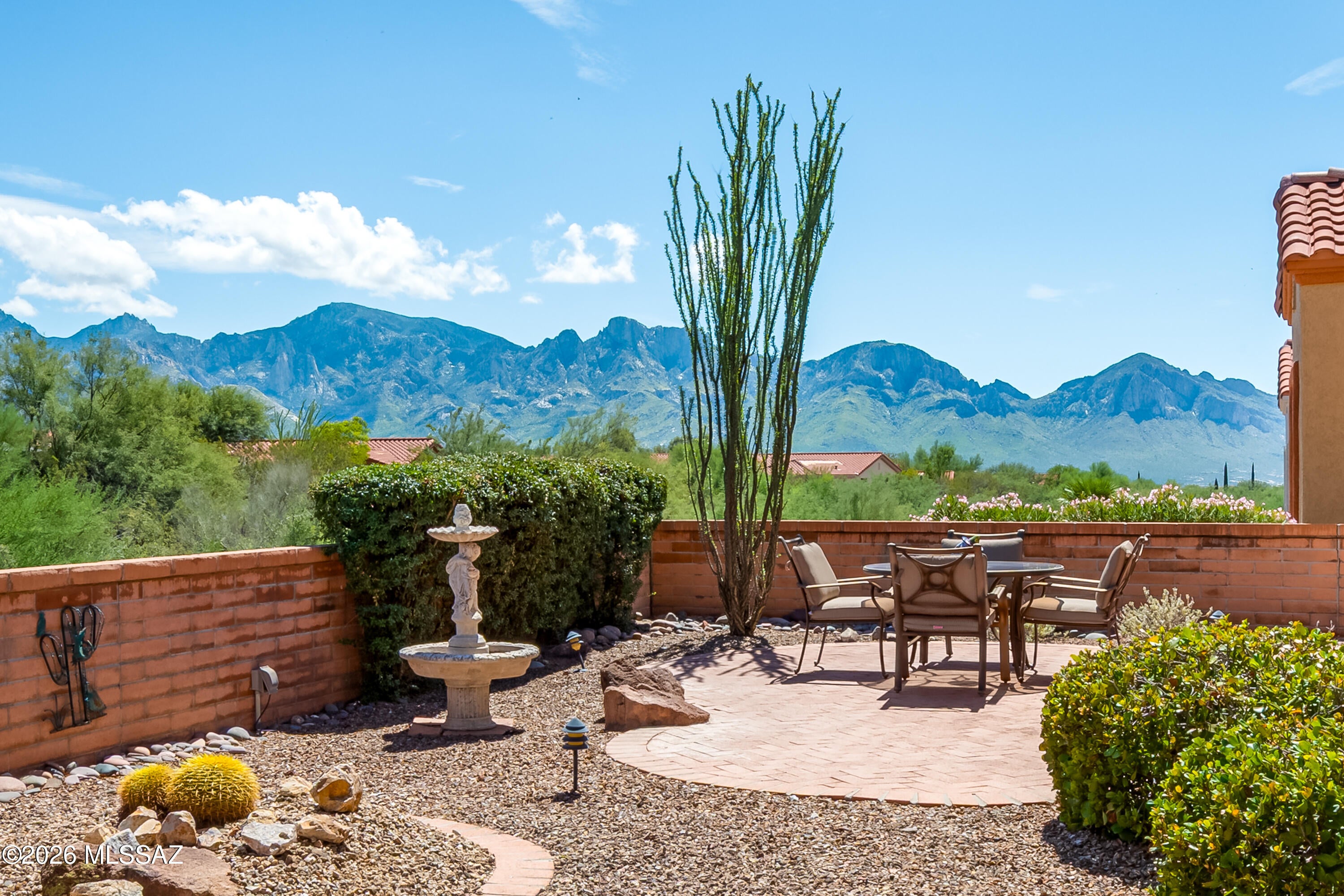 Enjoy Catalina Mountain views and exceptional privacy from this beautifully maintained expanded 1,683sf 2BR/2BA Barclay model in the highly sought-after active adult community of Sun City Oro Valley. Lovingly cared for by the original owner since 1995 you will find an inviting open-concept design perfect for everyday living & entertaining with east-facing backyard with panoramic Catalina Mountain views and no direct rear neighbors. Spacious great room features expansive view windows that frame the stunning mountain backdrop, creating a bright and welcoming atmosphere. Elegant formal room offers a versatile space for entertaining guests or quiet relaxation adding both functionality and charm to the home's thoughtful design. The beautifully updated chef's kitchen showcases rich maple cabinetry with a dark chestnut finish, soft-close drawers, convenient pull-out shelving, granite countertops, artistic tile backsplash, newer black appliances, breakfast bar seating and a sunny casual dining nook with bay window. The expanded primary suite features newer luxury plank flooring, generous walk-in closet & updated bath with dual sinks, granite counters, soaking garden tub & separate shower. Additional highlights include a newer HVAC system, newer roof underlayment, newer water heater & some newer windows. Garage has laundry area with utility sink, built-in storage cabinets, workbench. Residents of Sun City Oro Valley enjoy an outstanding resort-style lifestyle with golf, fitness center, swimming pools, pickleball, tennis, walking trails, restaurants, social clubs, arts programs, and countless recreational activities. Conveniently located near shopping, dining, medical facilities, Catalina State Park, hiking trails, and the Oro Valley Community Center. Experience the perfect combination of comfort, views, privacy, and active adult living in one of Oro Valley's most desirable communities.