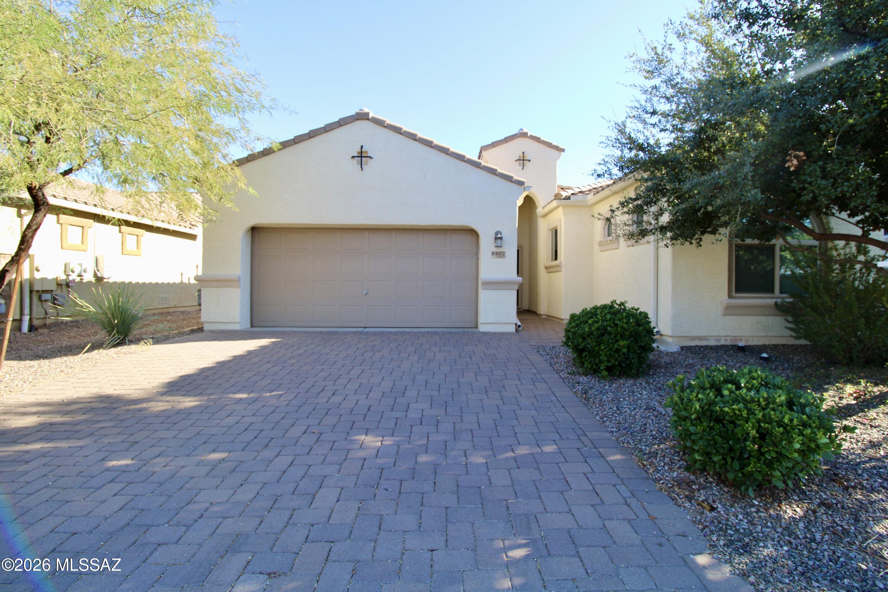 1834 SQ FT! 3 bedroom, 2 bath gorgeous home with a thoughtful single-story floor plan! The stunning kitchen with dining area boasts ample cabinetry and counter space and is complete with a center island and breakfast bar. All appliances included. Sizeable family room perfect for entertaining and relaxing. Tile flooring in all the right places. Large primary bedroom complete with a private bathroom that offers a walk-in closet, dual sinks, and a separate shower/bath. Two additional bedrooms with ample closet space and plush carpet. Laundry room with washer and dryer included. 2 car garage. Fully fenced backyard with covered back patio and low maintenance landscape. Beautiful and convenient Marana location close to schools, shopping, and entertainment.