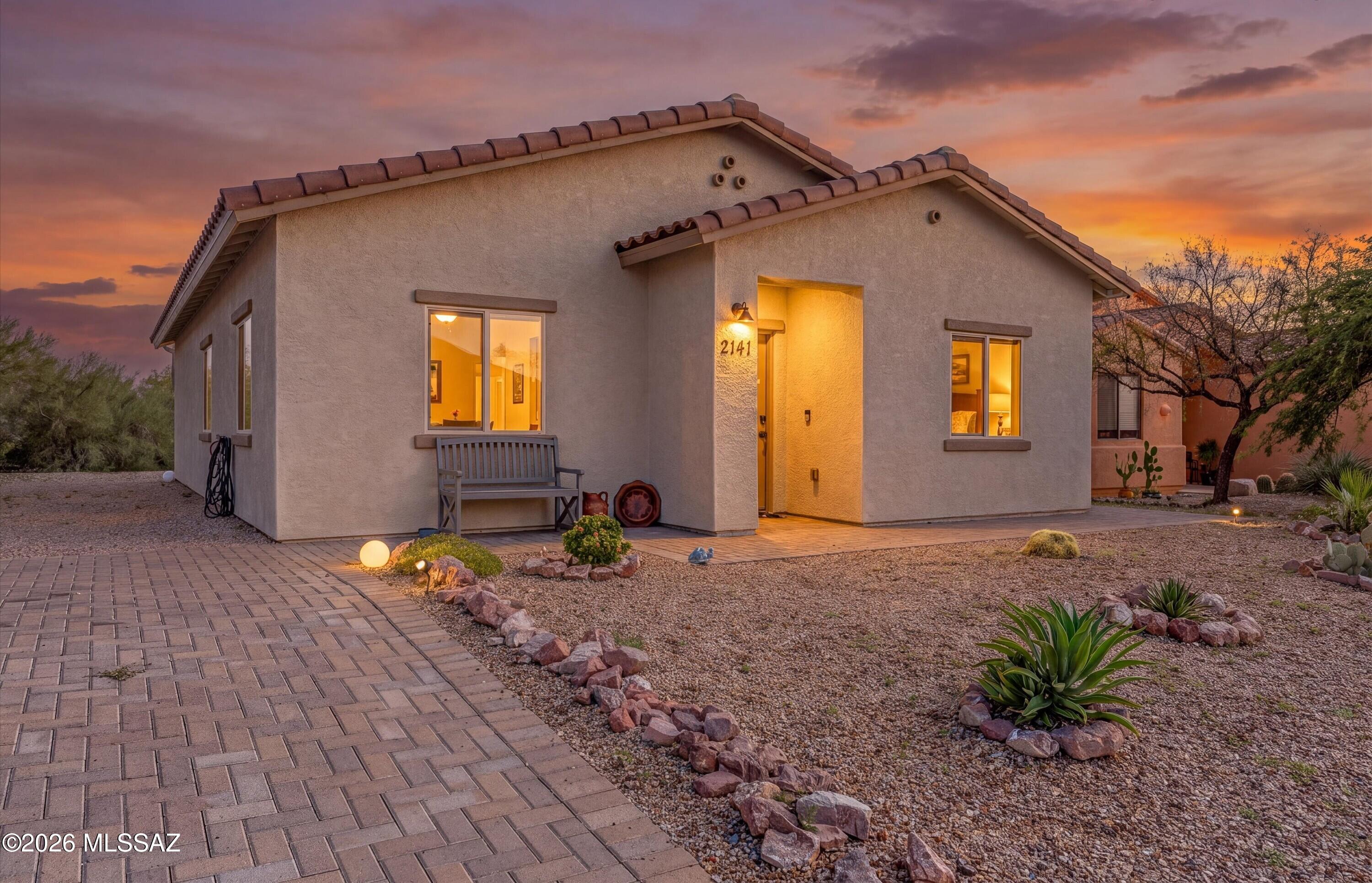 Newer construction, mountain views, and truly move-in-ready condition come together in this beautifully finished 3-bedroom, 2-bath home in Tucson Estates No. 2. Built in 2021, this single-level home offers a bright, open great-room design with ceramic tile throughout, abundant natural light, LED lighting, ceiling fans, and dual-pane windows.

The kitchen is both stylish and functional with granite countertops, crisp white cabinetry, generous pantry storage, and stainless steel appliances, flowing seamlessly into the dining and living spaces for easy everyday living and entertaining.

The spacious primary suite features a generous closet and private full bath, while two additional bedrooms provide flexibility for guests, a home office, or hobby space.

Outside, enjoy low-maintenance d landscaping, a paver driveway, tile roof, stucco exterior, and beautiful surrounding mountain and desert views. The refrigerator, washer, and dryer all convey, making this home even easier to settle into from day one.
Residents of Tucson Estates No. 2 also enjoy access to community amenities including a pool, spa, tennis, pickleball, and clubhouse, all just minutes from the scenic trails and natural beauty of Tucson Mountain Park.