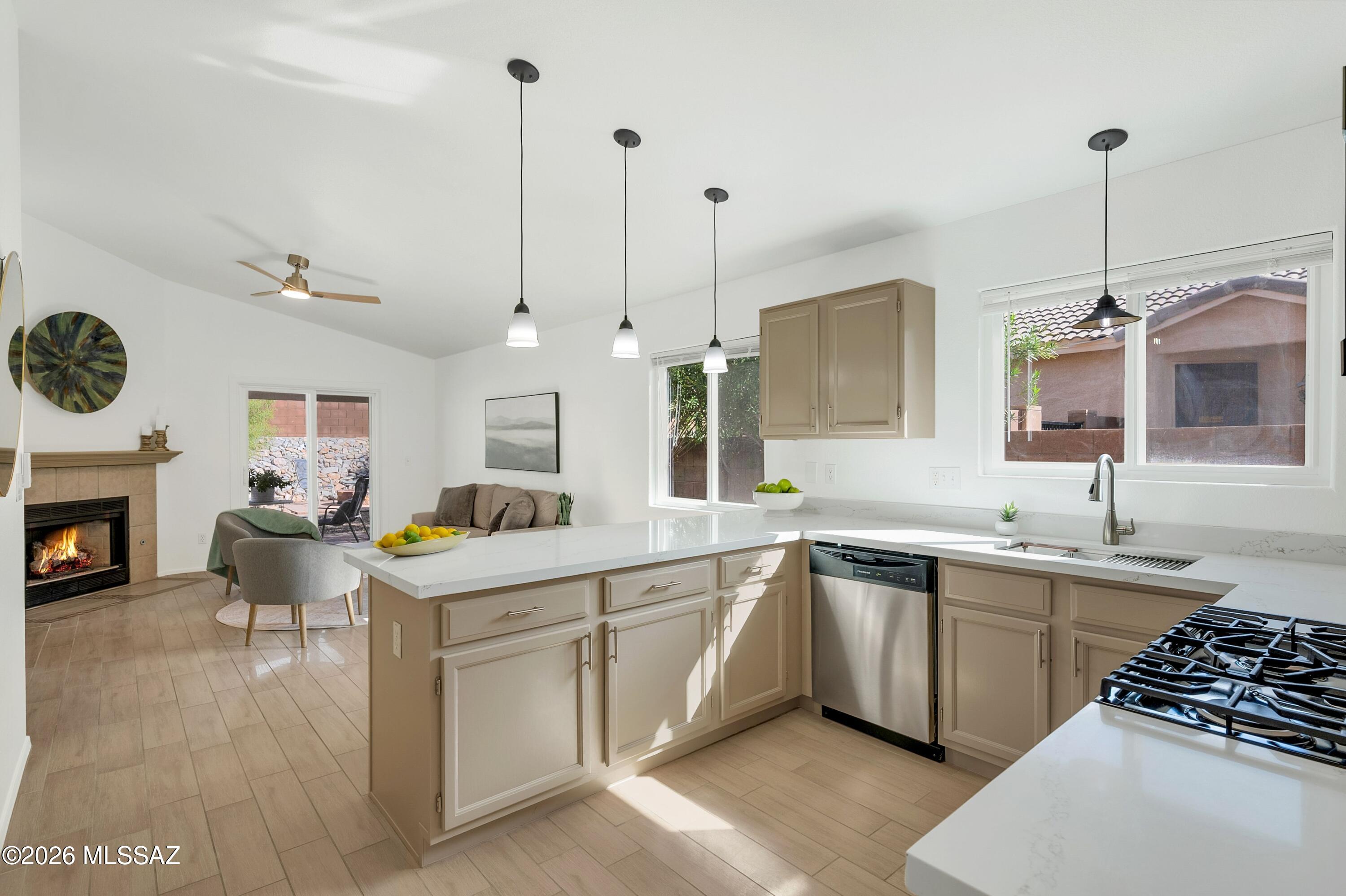 OWNER/AGENT. Dove Mountain Living at its Finest w/ Extensive Upgrades & Cost-Saving Improvements! One-Year Home Warranty Offered. Stay Cool w/ OWNED Tesla Solar, Brand New HVAC, Newer Dual Pane Windows/Slider & Ceiling Fans Every Room. New Stainless-Steel Appliances, Beautiful Quartz Countertops & Refinished Cabinetry w/ New Hardware in Kitchen & Bathrooms. Contemporary Tile Floor Throughout Entire Home. Spacious Living Room & Family Room w/ Gas Cozy Fireplace. Private Owner's Suite w/ Walk-In Closet & Large Walk-In Shower w/ Grab Bars & Bench. Covered Patio & Pergola, Gas Fire Pit, Grapefruit Tree, Lemon Tree, King Palm & Oleanders. Clear Sewer Scope & Termite Inspection. New Garage Door & Shelving in the 2-Car Garage. Too Many Upgrades to List! Take a Look Today! Enjoy a Quiet Dove Mountain Neighborhood w/ Community Park, Dog Park, Walking, Hiking & Riding Trails. Enjoy the Dove Mountain Lifestyle w/ Access to 81-Holes of Championship Golf at The Gallery Golf Club, The Golf Club at Dove Mountain & The Highlands at Dove Mountain. Excellent Variety of Restaurants, Cafés & Shopping at the Outlet Mall, Top Rated Schools & Easy Access to I-10. 

Simply Move In & Enjoy! With Extensive Updates, Stylish Finishes & an Incredible Dove Mountain Location, this Home is Ready to Welcome You!