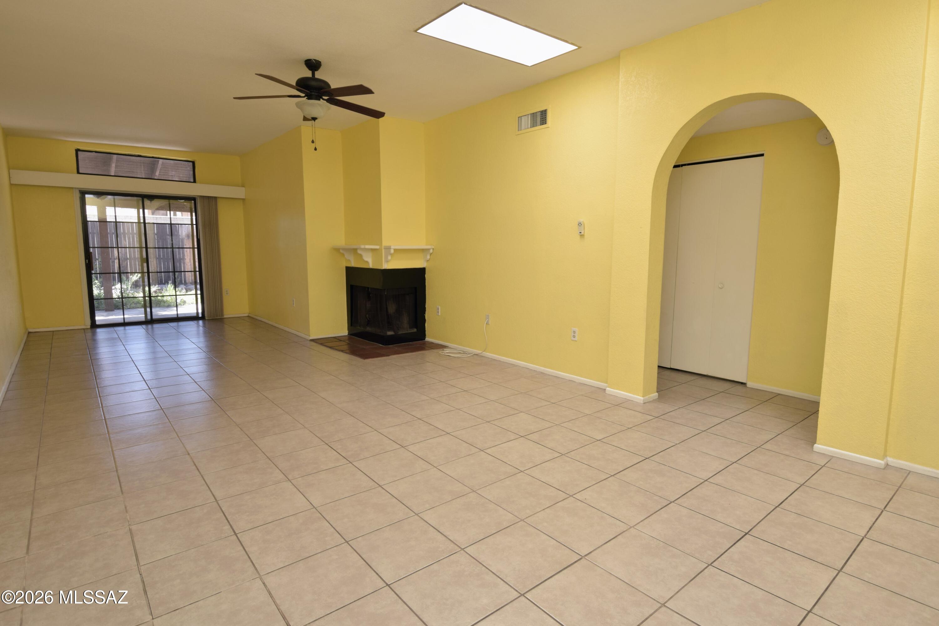 Experience a rare opportunity to live in the small, sought-after community of Acacia Pueblos, perfectly situated in the heart of Tucson near top-tier dining and local amenities. This stunning 1,202-square-foot townhouse features two spacious bedrooms and two bathrooms, headlined by a primary suite with a charming bay window and a private bathroom featuring a walk-in shower. The expansive living area feels incredibly open and airy thanks to soaring 10-foot ceilings, vibrant interior colors, and an abundance of natural light streaming in through multiple skylights. Practicality meets comfort with central air conditioning and heating, a full-size in-unit laundry room, and a rare two-car garage for secure parking and extra storage. Residents enjoy exclusive access to premium community amenities, including a refreshing pool, relaxing spa, and an entertainment area perfect for weekend gatherings. Dogs are considered in this inviting space, making it a complete package for those seeking a stylish and convenient desert lifestyle. This home is offered only to NON-SMOKING tenants.